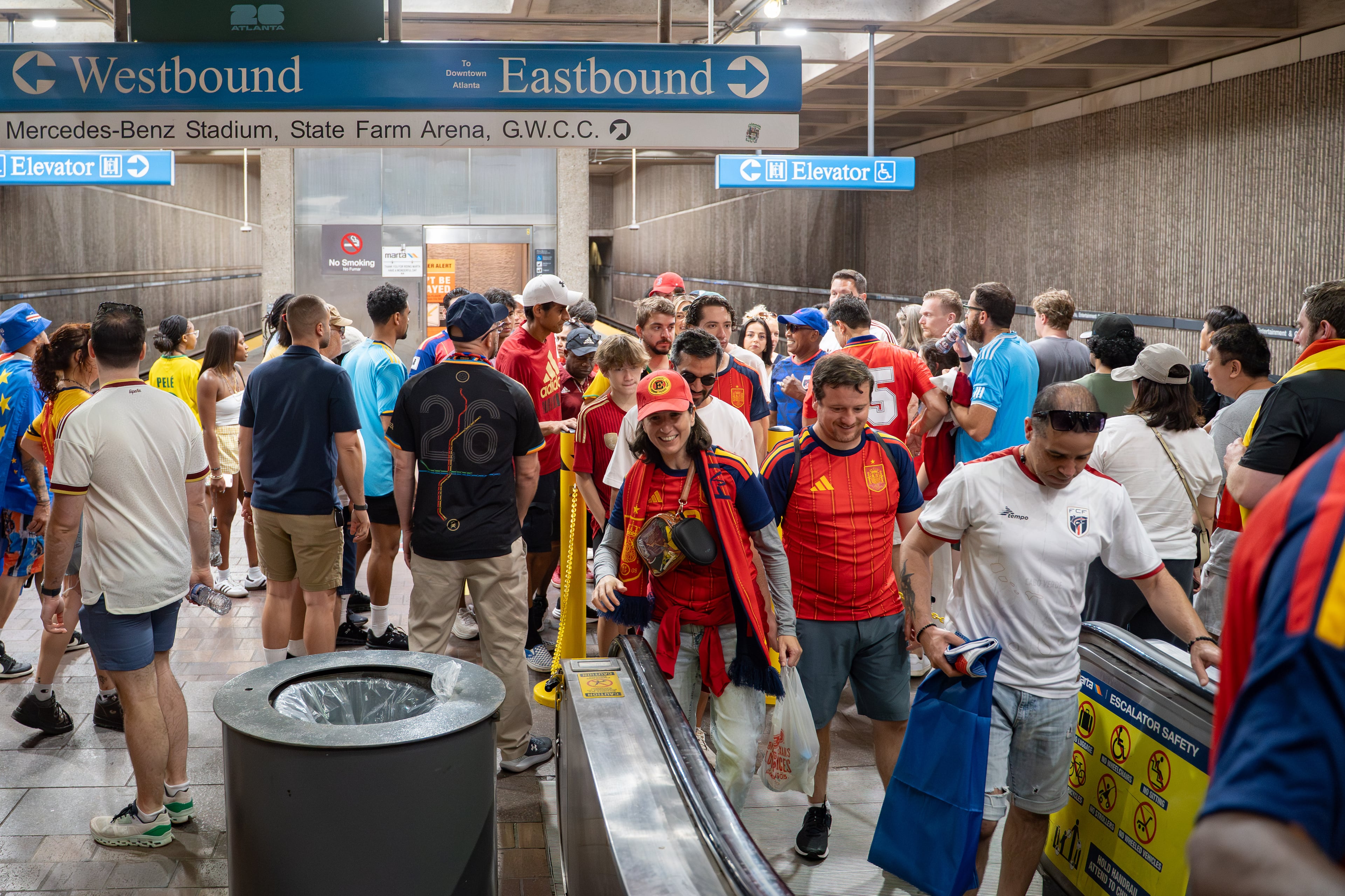 People wait in line for an escalator inside the SEC District MARTA station as fans attend the first FIFA match held in Atlanta on Monday, June 15, 2026. (Ben Hendren for the AJC)
