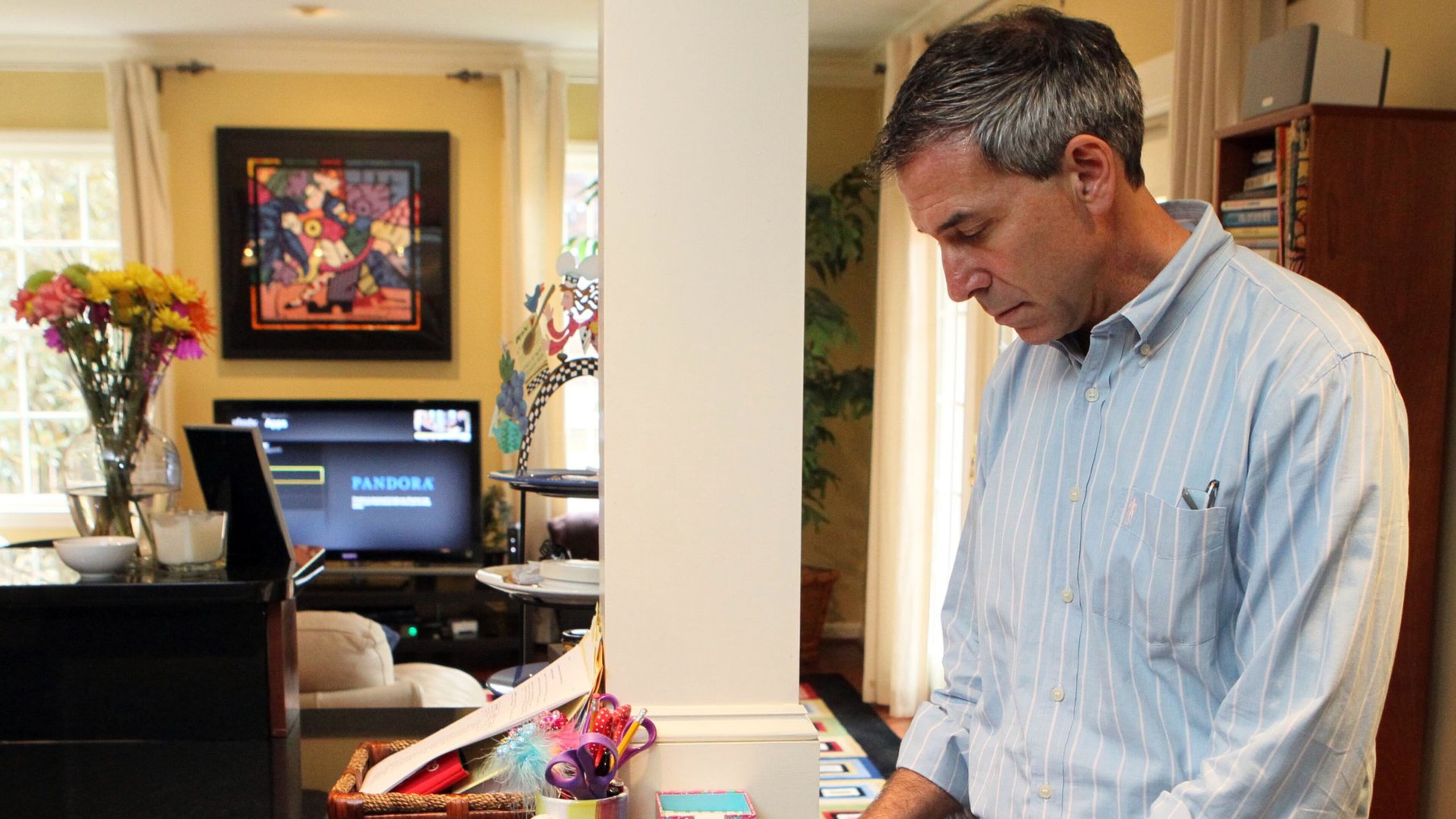 Larry Schweber is able to watch TV shows remotely through his iPad, turn on his alarm system, view video camera angles, or turn on lights from his smartphone as part of the monitoring system at his Atlanta home.