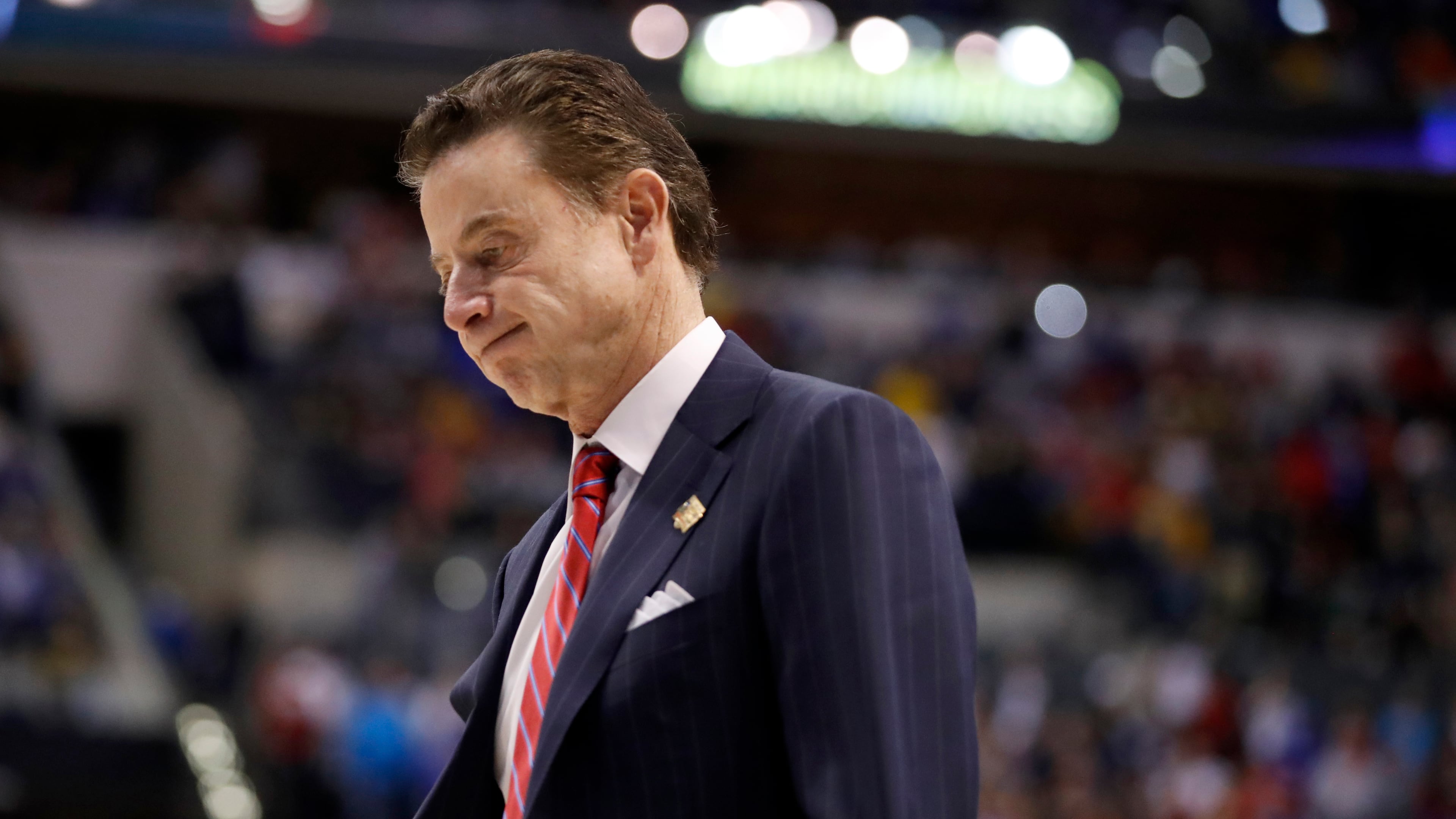 Louisville head coach Rick Pitino has long denied knowledge of the NCAA's findings that a former basketball program staffer provided strippers and prostitutes for players and recruits. (AP photo)