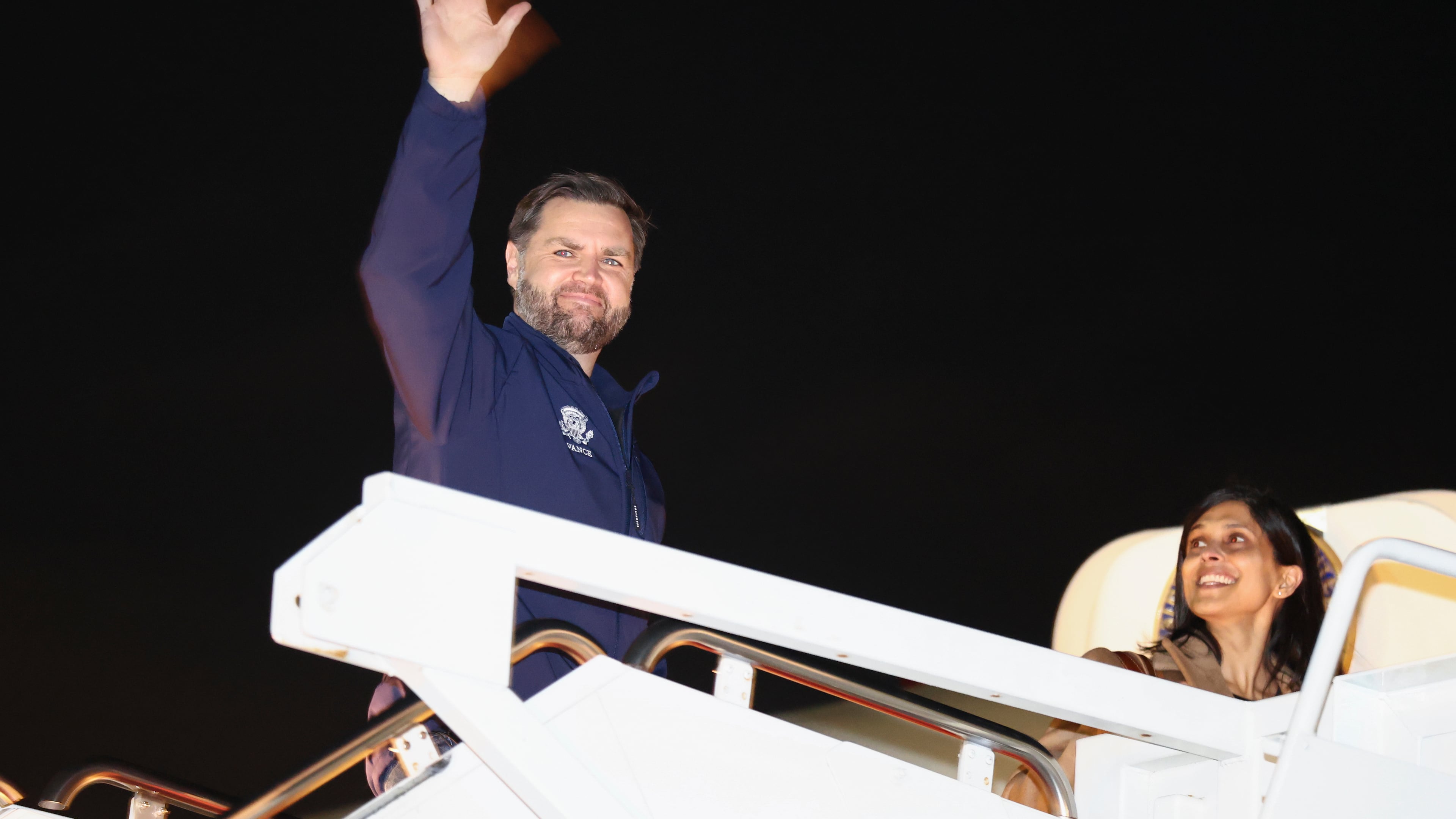Vice President JD Vance waves as he and second lady Usha Vance board Air Force Two to travel to the Milano Cortina 2026 Winter Olympics in Italy, from Joint Base Andrews, Md., Feb. 4, 2026. (Kevin Lamarque/Pool via AP)