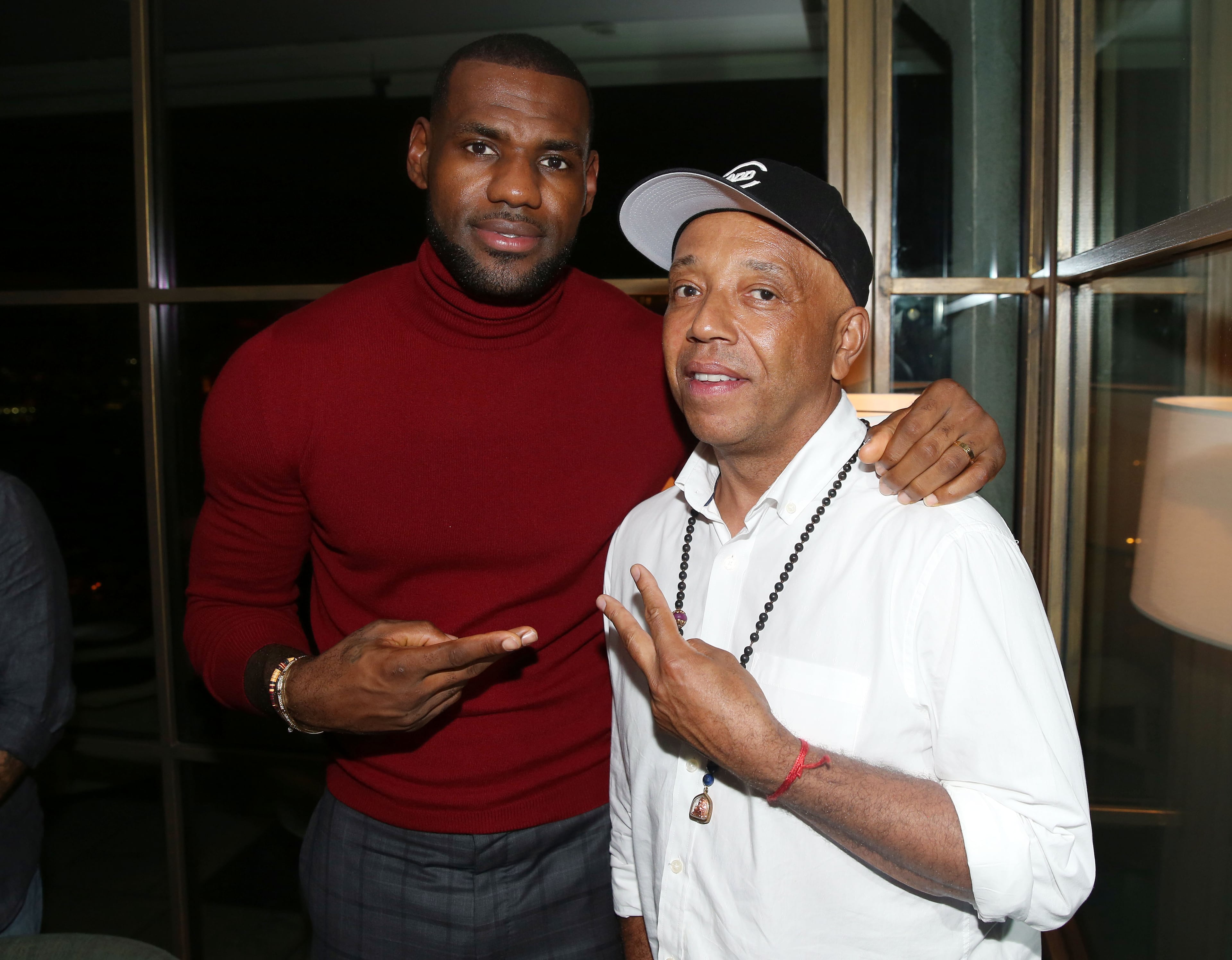 LeBron James, left, and Russell Simmons pose together at the after party for the premiere of the STARZ original series "Survivor's Remorse" on Tuesday, Sept. 23, 2014 in Los Angeles. "Survivor's Remorse" premieres Saturday, Oct. 4 exclusively on STARZ . (Photo by Matt Sayles/Invision for STARZ EntertainmentAP Images)