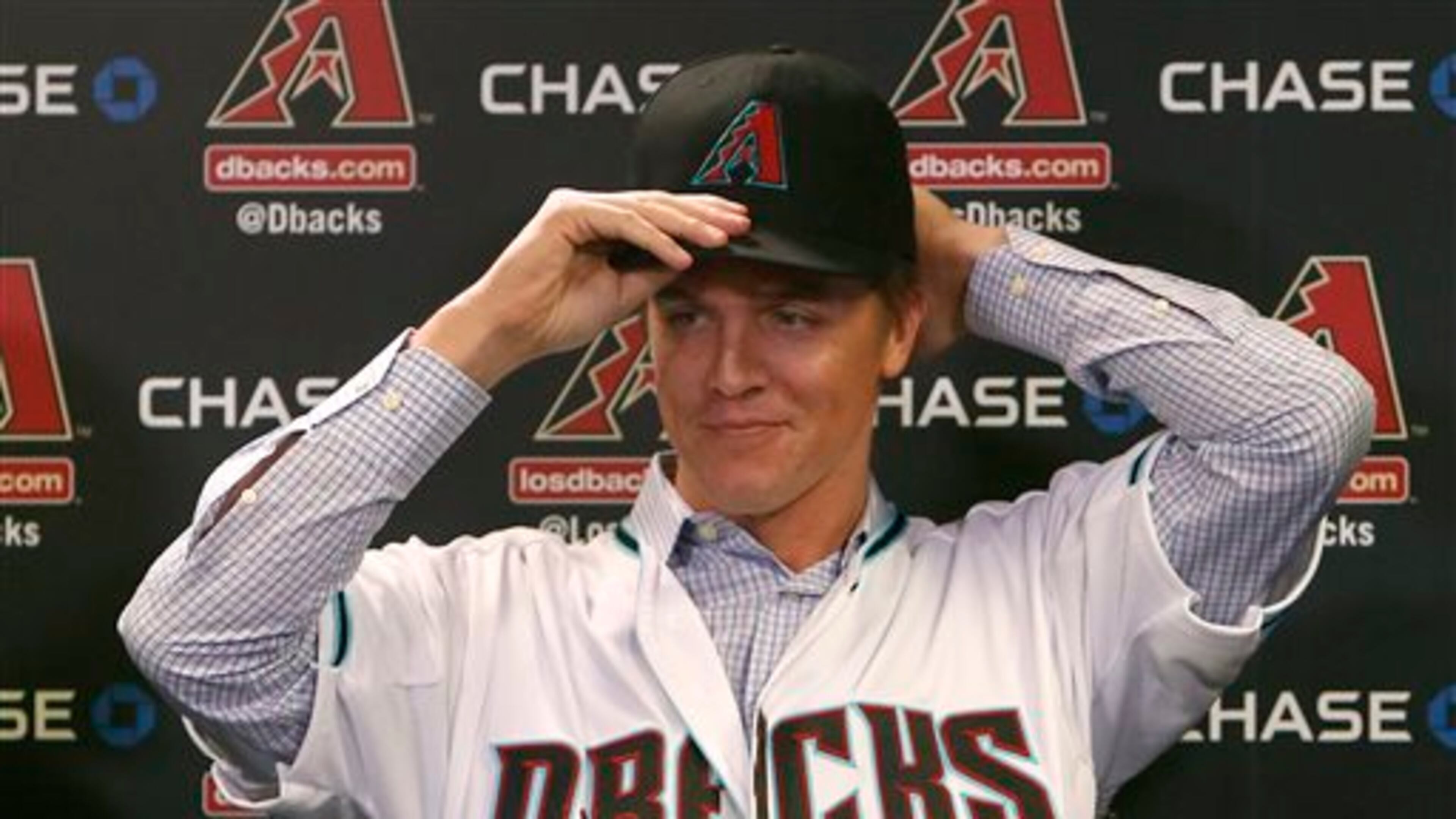 Arizona Diamondbacks pitcher Zack Greinke talks to the media during a press conference, Friday, Dec. 11, 2015, in Phoenix. Greinke could have stayed with the Los Angeles Dodgers or gone up the coast to the San Francisco Giants. Instead, he signed a massive contract with the Arizona Diamondbacks, dramatically shifting the landscape in the NL West. (AP Photo/Rick Scuteri)