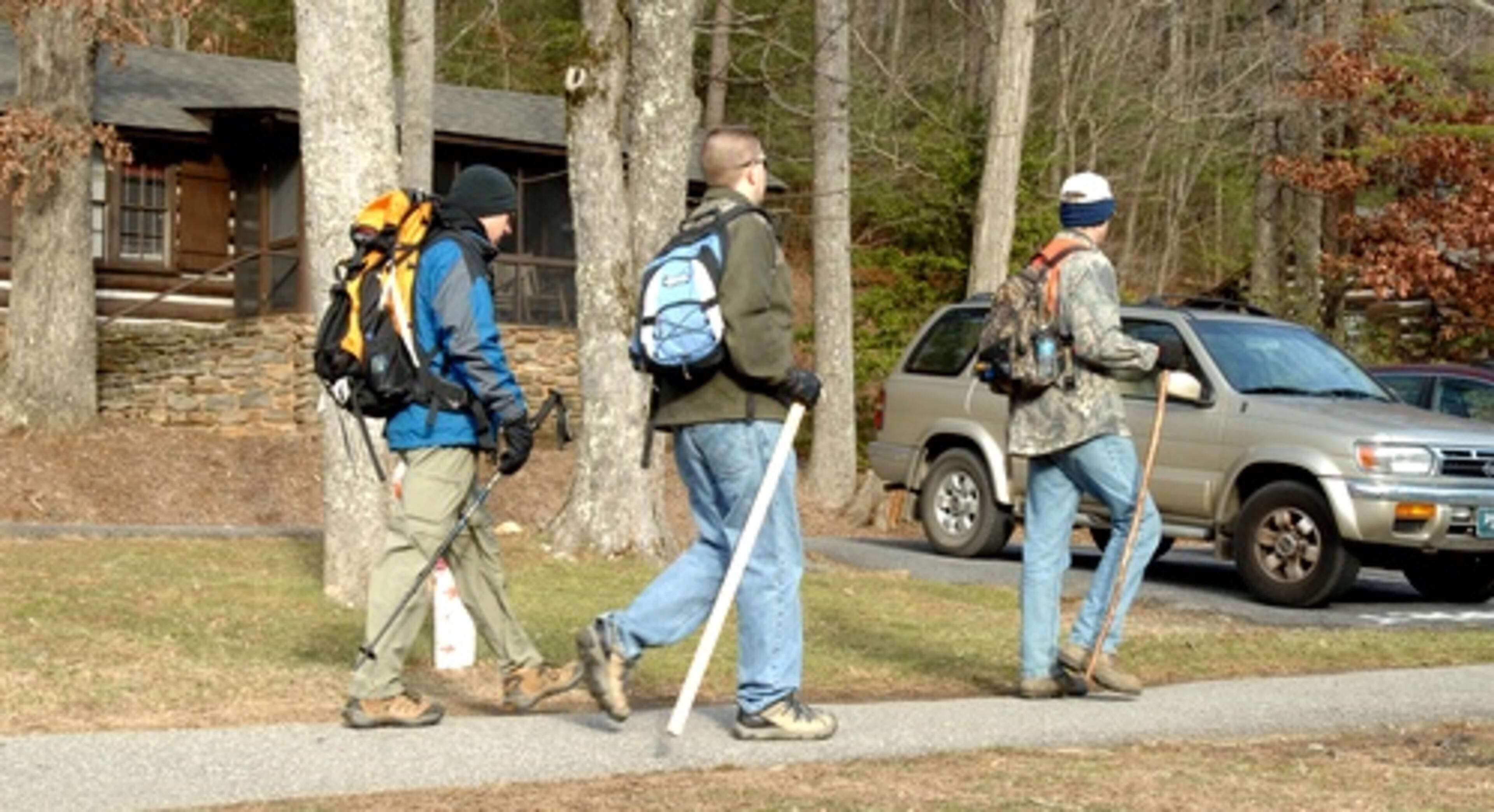 Small teams of volunteer civilian searchers pass the guarded checkpoints to the command center at Vogel State Park. They were going in to be assigned to larger parties designated by authorities.