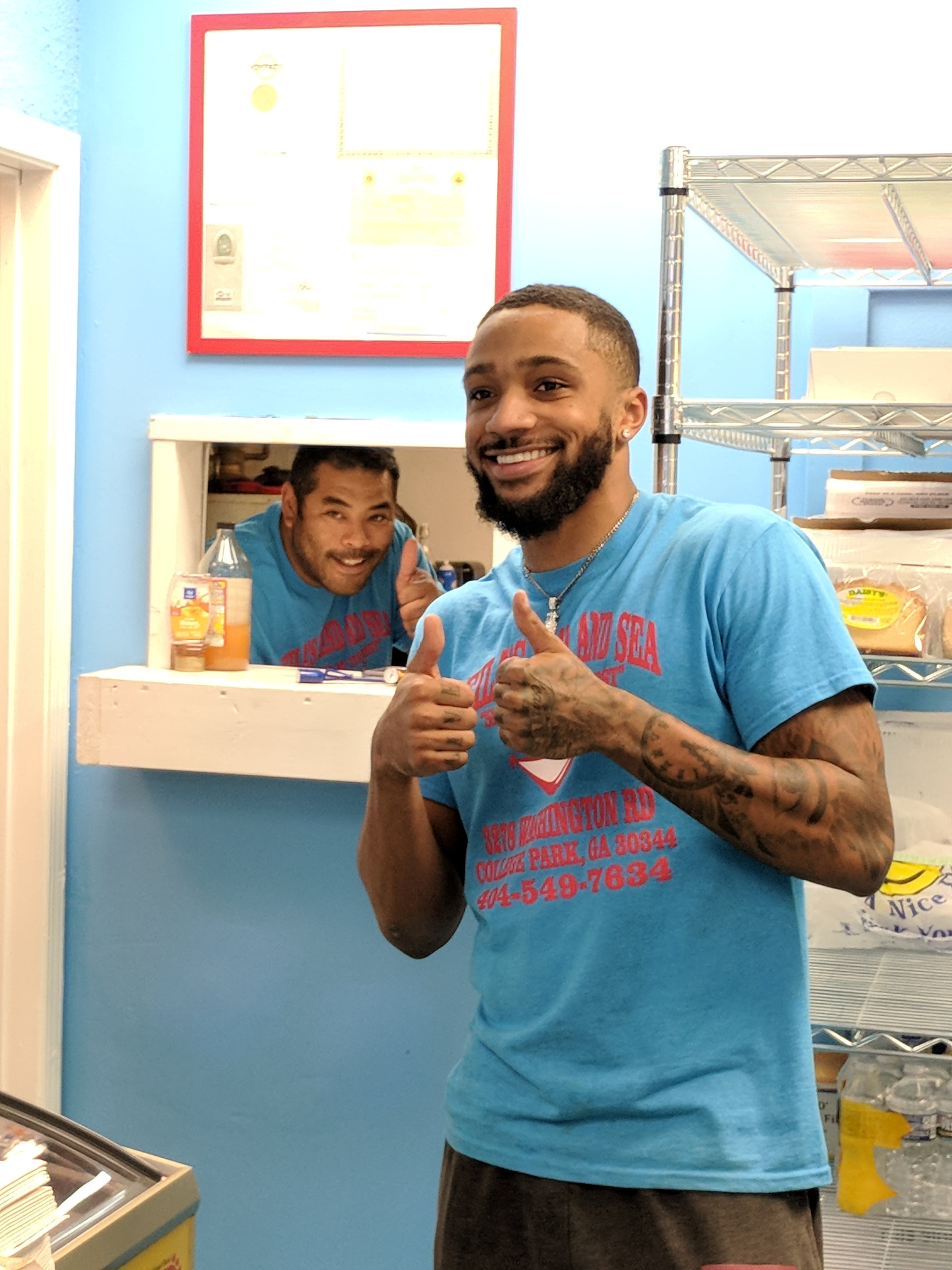 Leila’s Land & Sea owner Perry Owens (left) with employee Shawn Reed. Owens, a recent transplant from Philadelphia, opened the East Point seafood shack one year ago. CONTRIBUTED BY PAULA PONTES