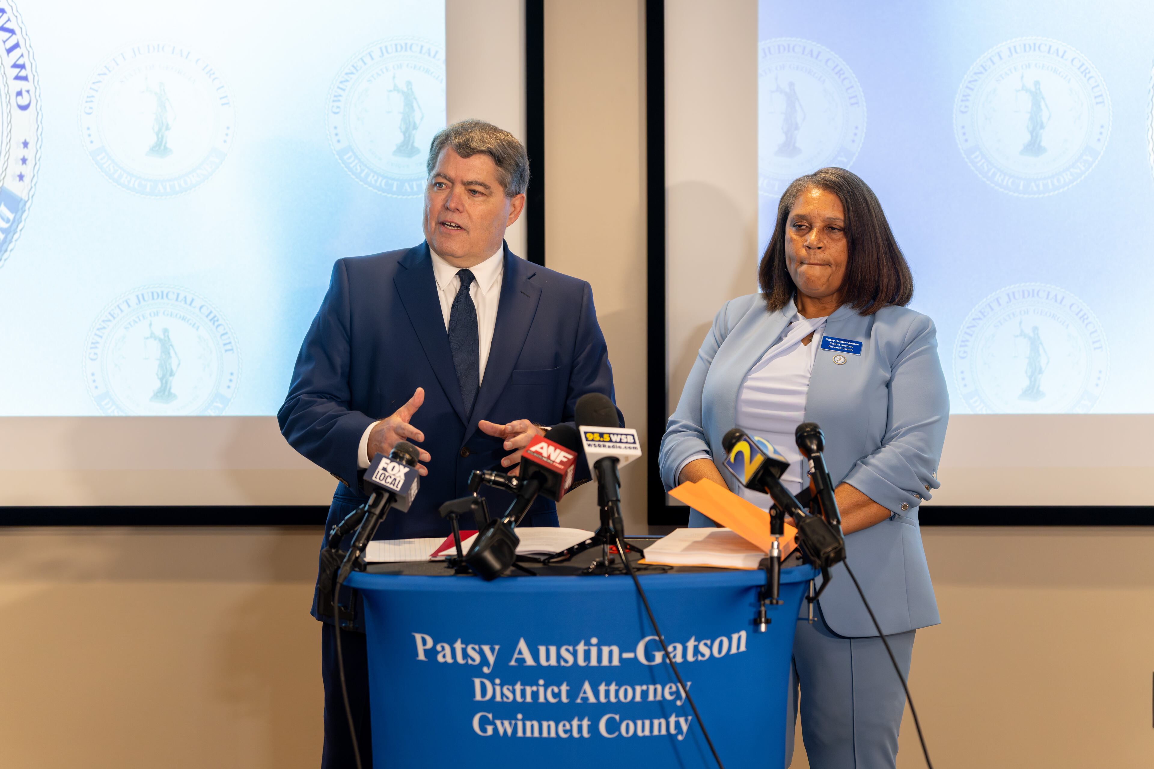 Gwinnett County District Attorney Patsy Austin-Gatson, right, stands with her attorney Michael B. Terry of Bondurant, Mixson & Elmore as she announces a lawsuit challenging House Bill 369 on Friday, Aug. 28, 2026. (Ben Hendren/AJC)