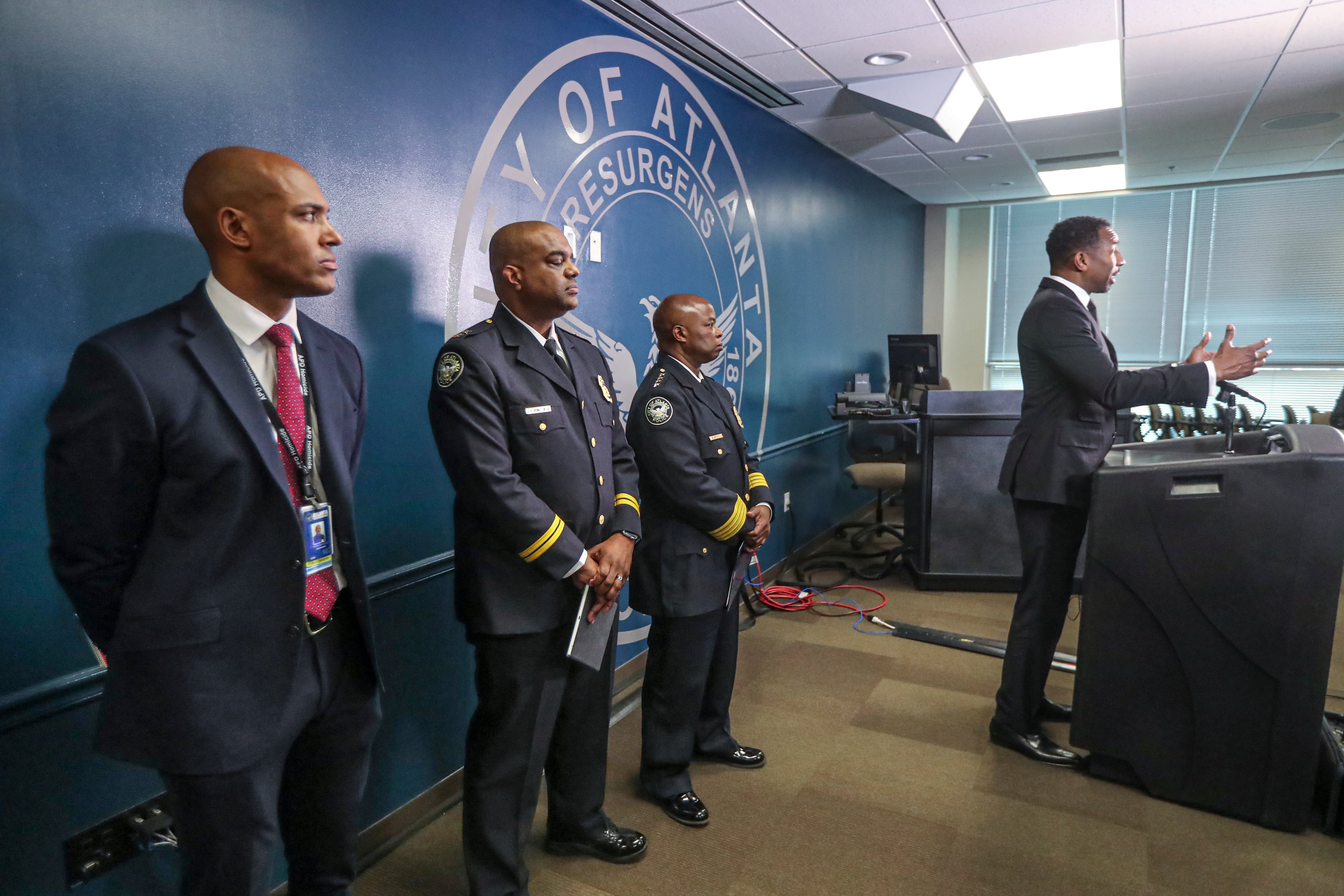 Atlanta Mayor Andre Dickens speaks at a press conference at APD headquarters as police command staff look on. (John Spink / John.Spink@ajc.com)