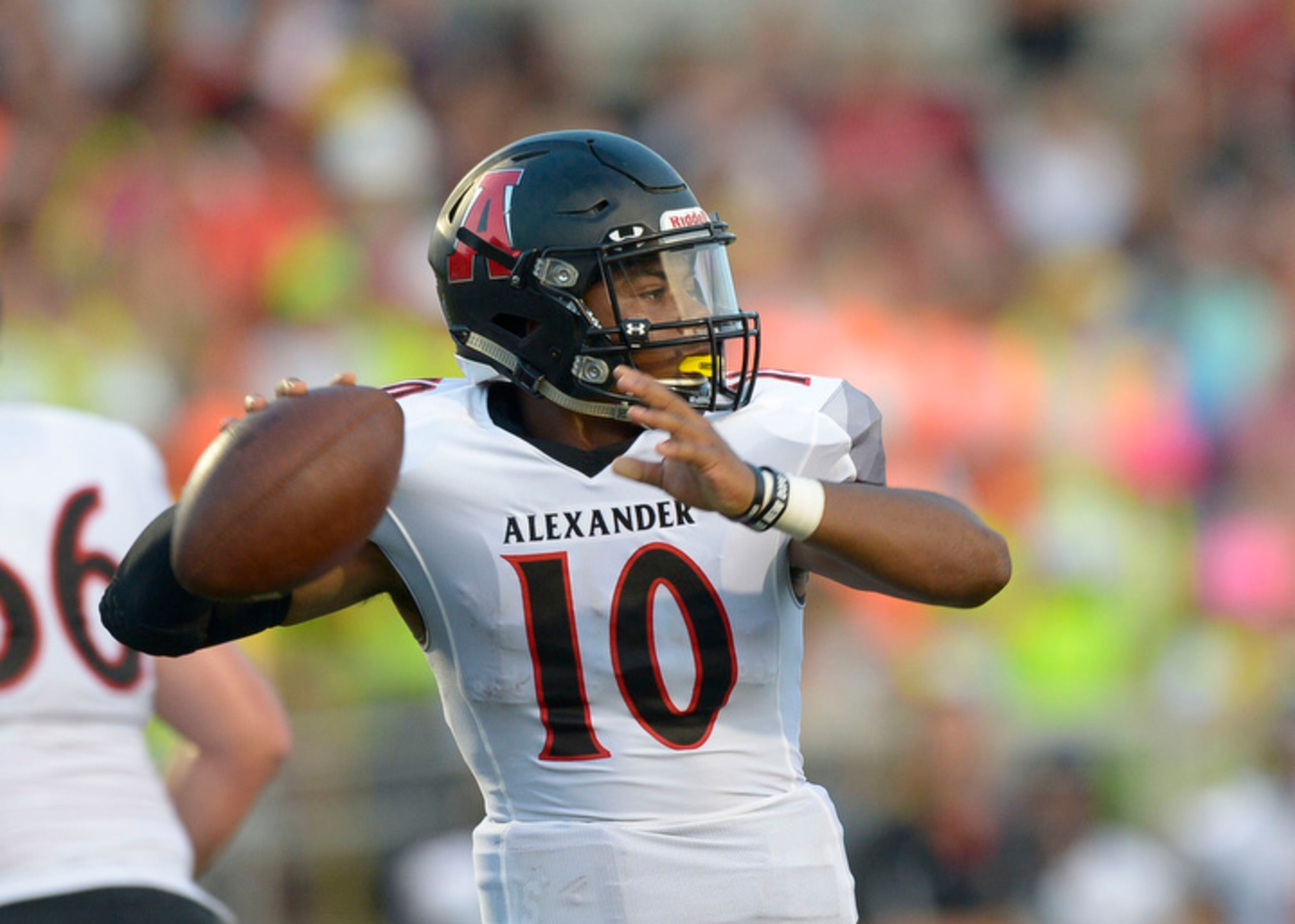 Alexander senior QB Mason Wood (10) drops back for a pass in the first half of his game at Allatoona Friday, August 25, 2017.