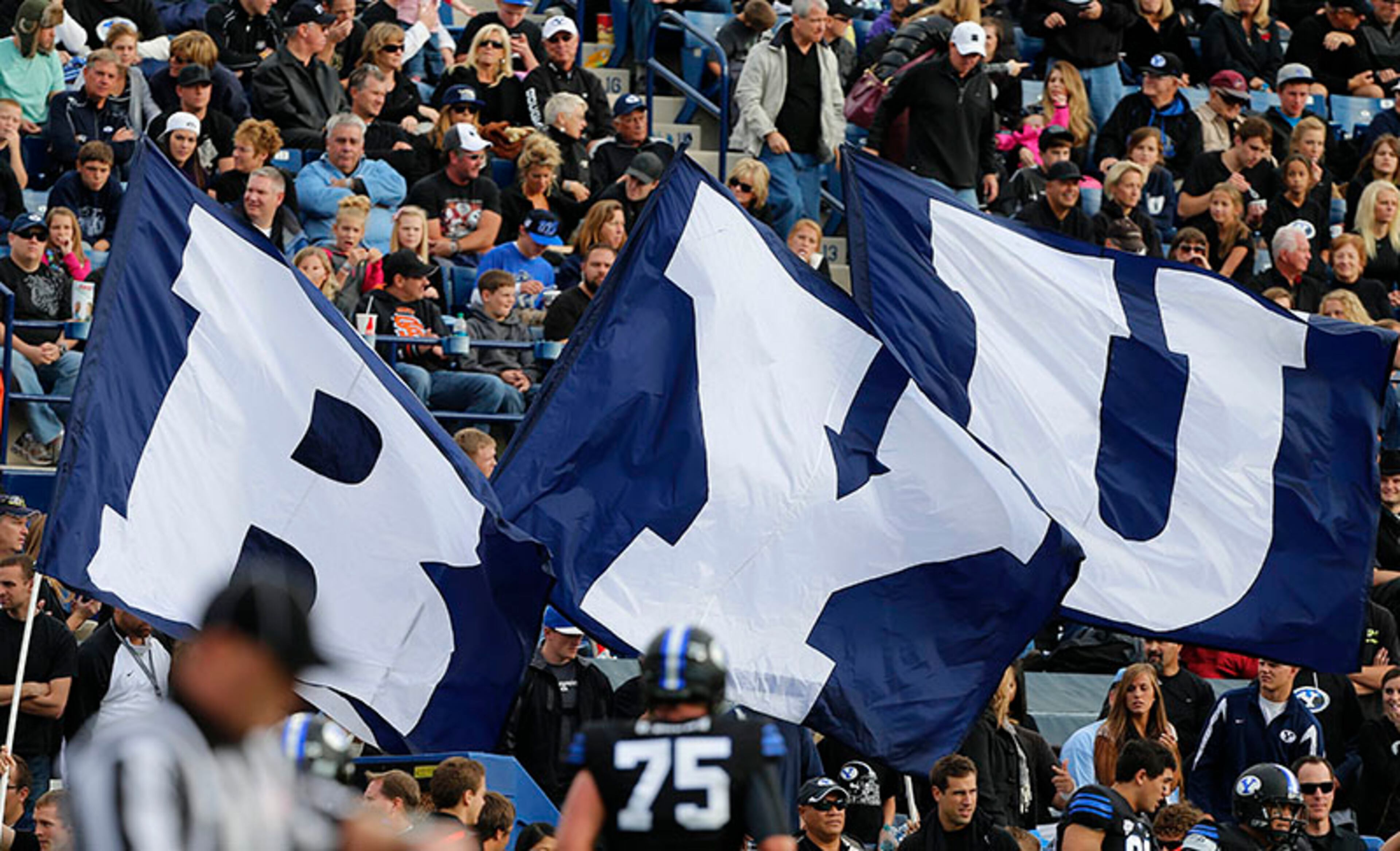 BYU flags fly in the stadium during a game between the BYU Cougars and the Oregon State Beavers during the first half of a college football game Oct. 13, 2012, at LaVell Edwards Stadium in Provo, Utah.