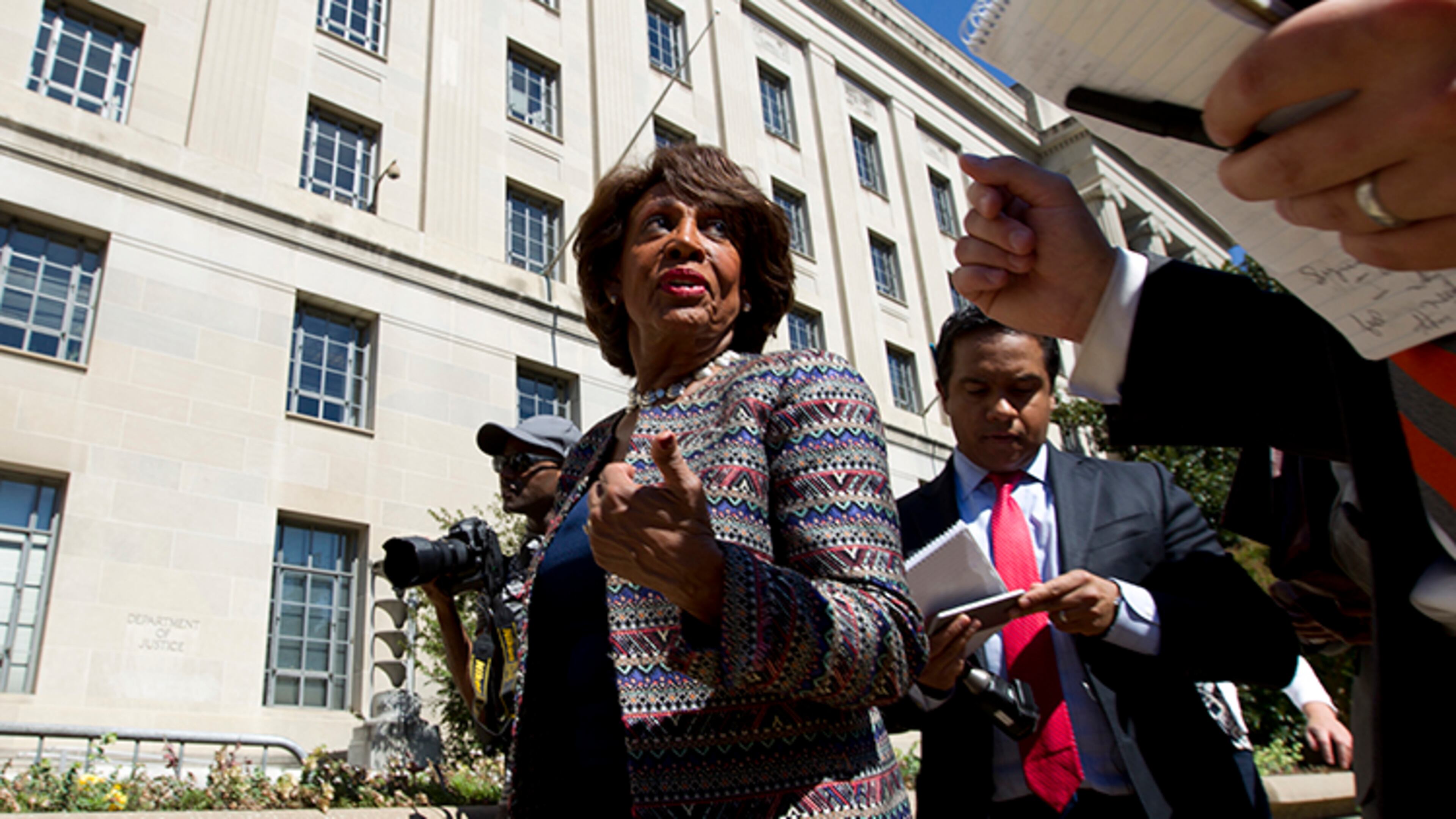 In this Sept. 22, 2016 file photo, Rep. Maxine Waters D-Calif., accompanied by other members of the Congressional Black Caucus (CBC), speaks to the media outside of the Justice Department in Washington. Waters has served in Congress for a quarter-century. Now she's turned into the passionate voice of resistance against the Trump administration.