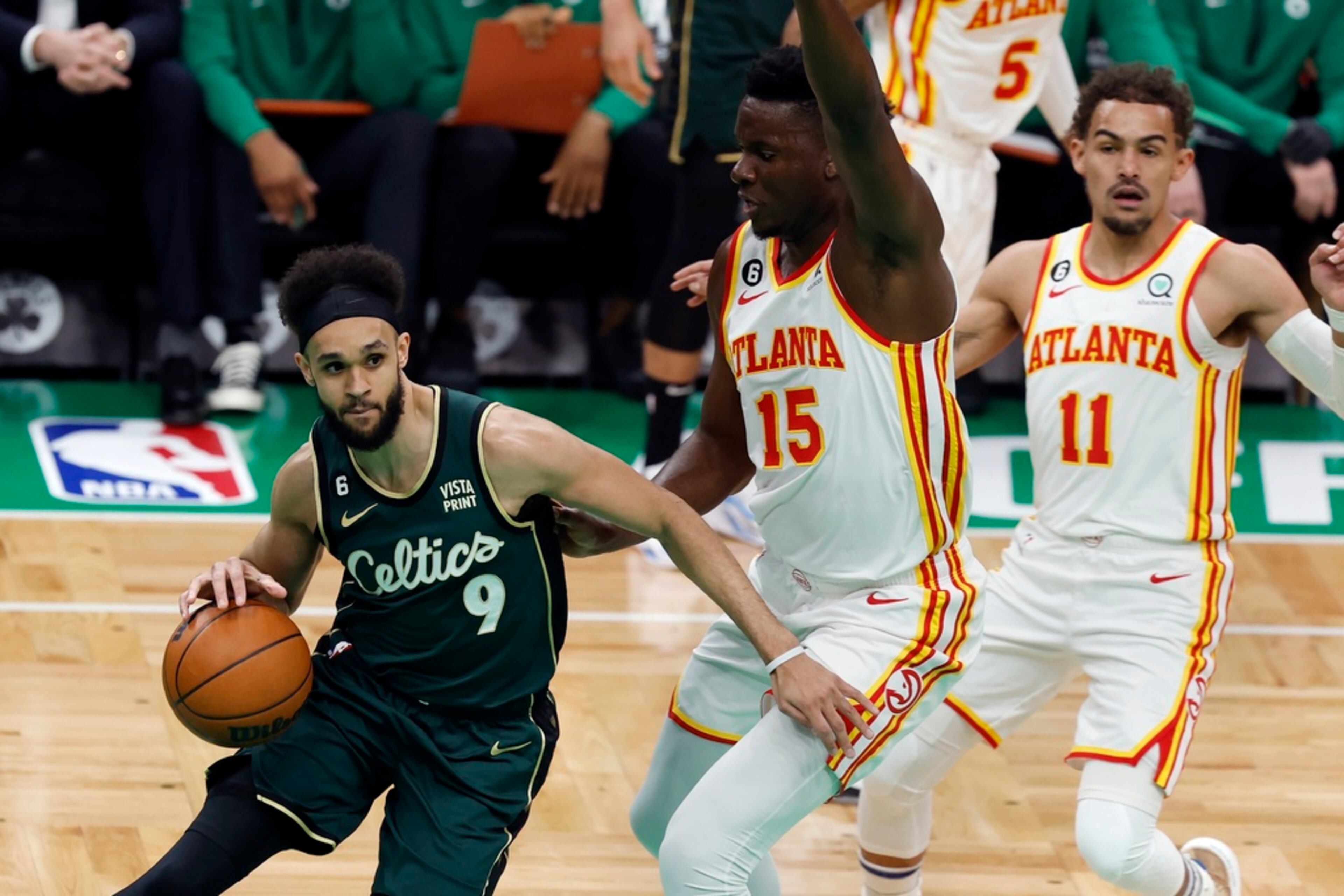 Boston Celtics' Derrick White (9) drives past Atlanta Hawks' Clint Capela (15) in the first half during Game 1 in the first round of the NBA basketball playoffs, Saturday, April 15, 2023, in Boston. (AP Photo/Michael Dwyer)