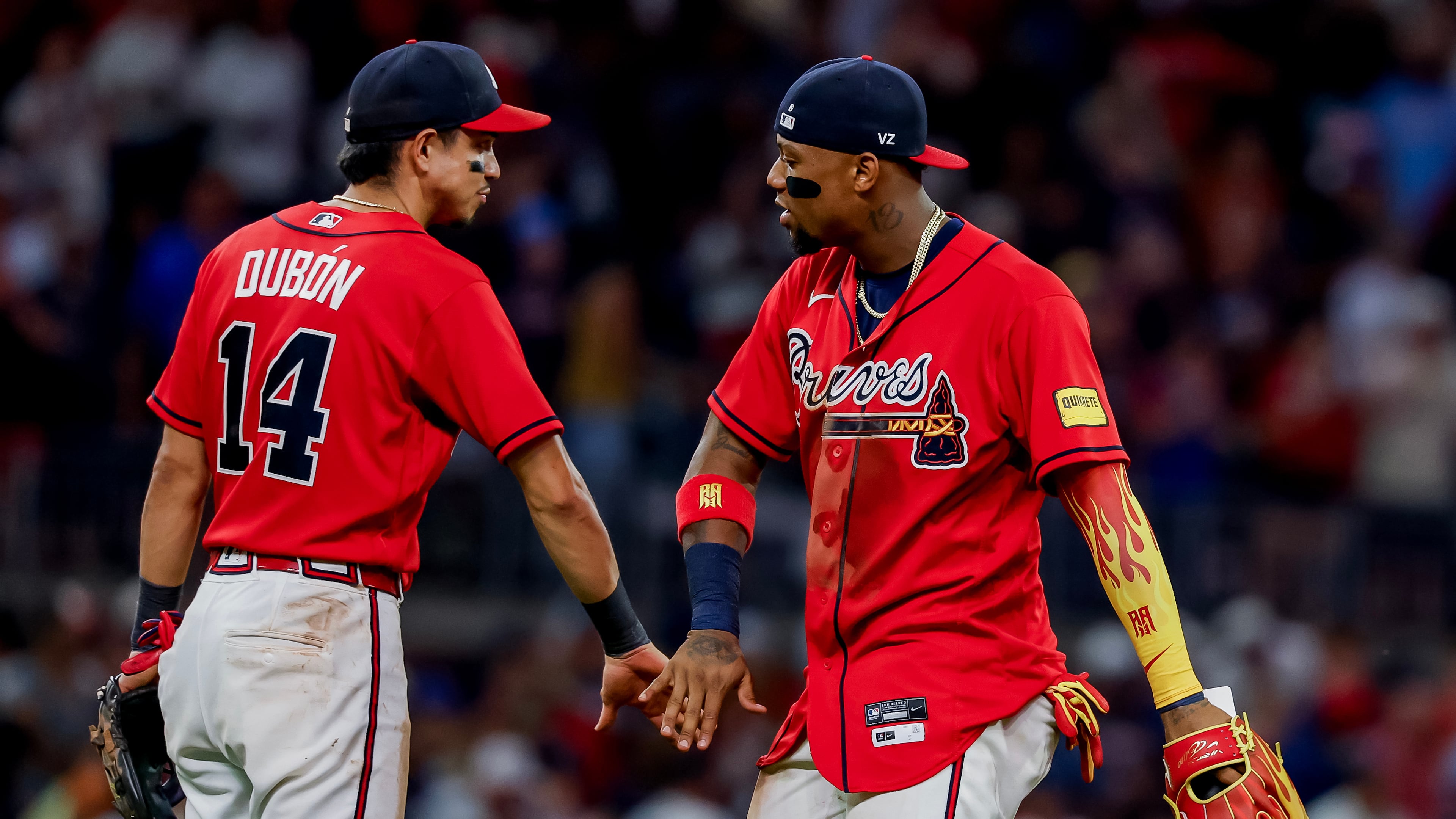Atlanta Braves' Ronald Acuña Jr., right, celebrates with Mauricio Dubón (14) after their team defeated the Colorado Rockies in a baseball game, Friday, Aug. 28, 2026, in Atlanta. (AP Photo/Erik S. Lesser)