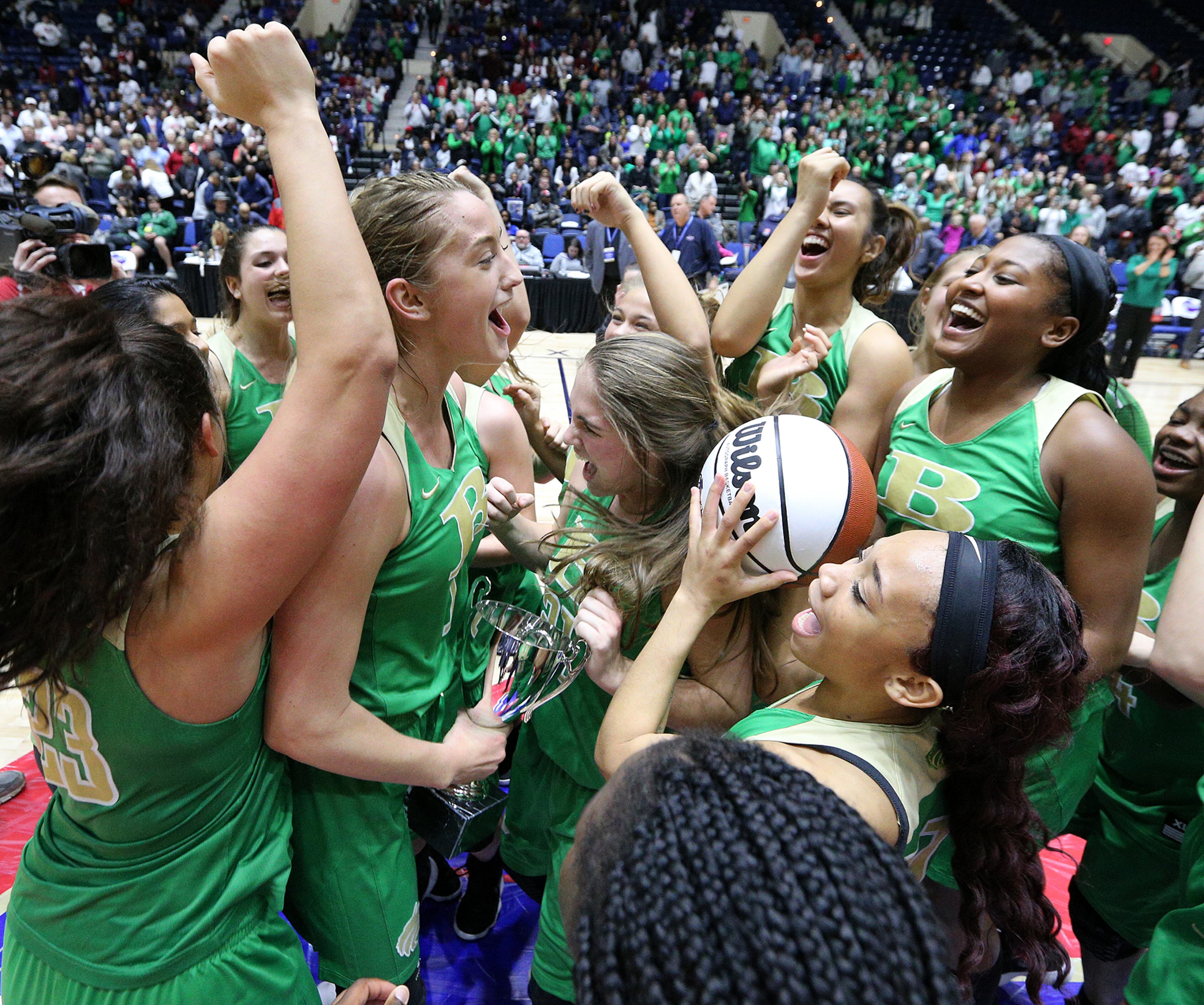 March 8, 2018 Macon: Buford celebrates beating Flowery Branch 60-49 in their GHSA state basketball championship game on Thursday, March 8, 2018, in Macon. Curtis Compton/ccompton@ajc.com