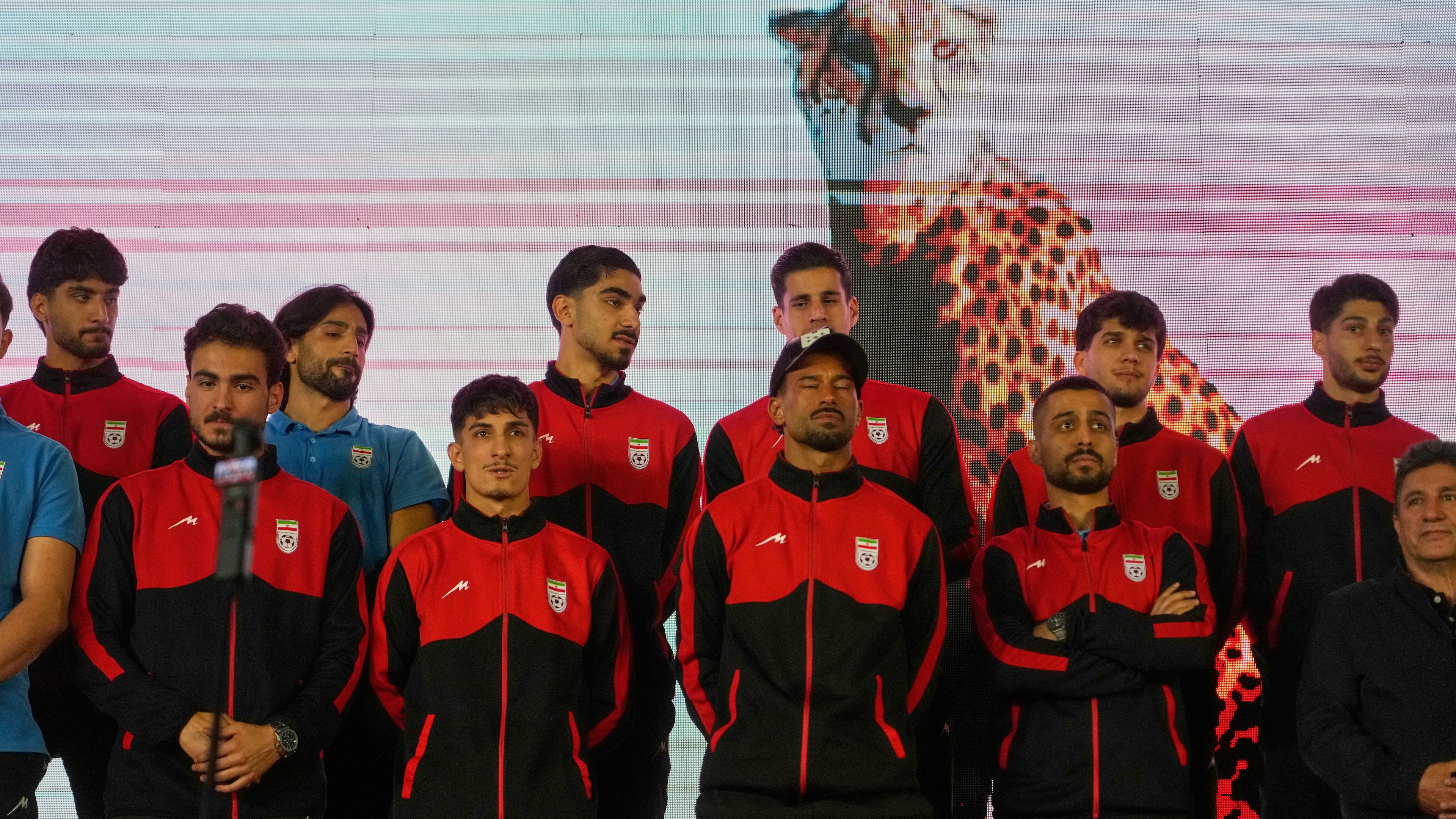Iran's national soccer team players stand onstage as they are greeted by a crowd during a pro-government gathering before their departure for training and friendly matches in Turkey ahead of the World Cup at Islamic Revolution Square in Tehran, Iran, Wednesday, May 13, 2026. (AP Photo/Vahid Salemi)