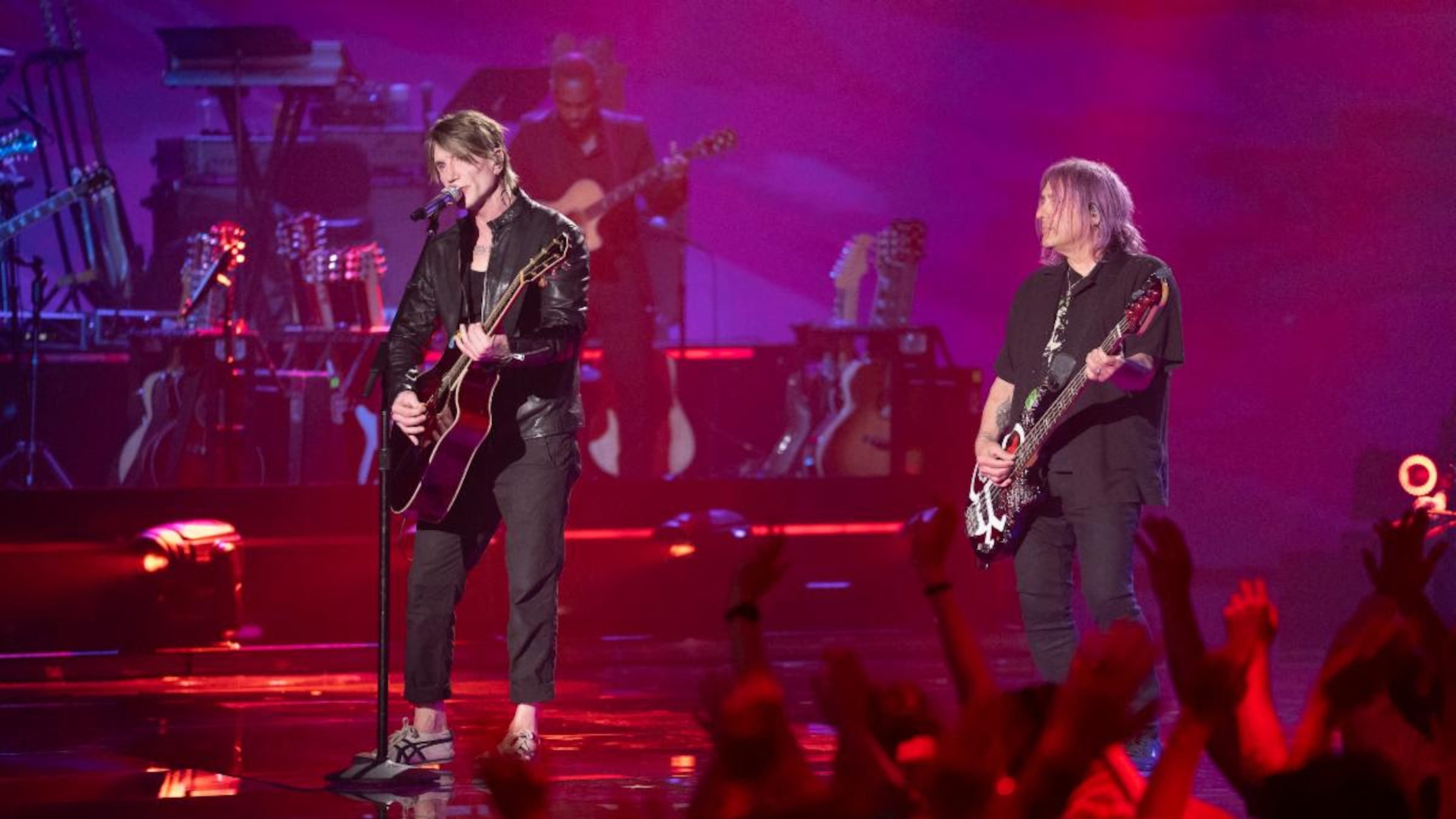 The Goo Goo Dolls — lead vocalist and guitarist John Rzeznick (from left) and bassist-vocalist Robby Takac — play Synovus Bank Amphitheater at Chastain Park on Tuesday. (Courtesy of Disney/Christopher Willard)