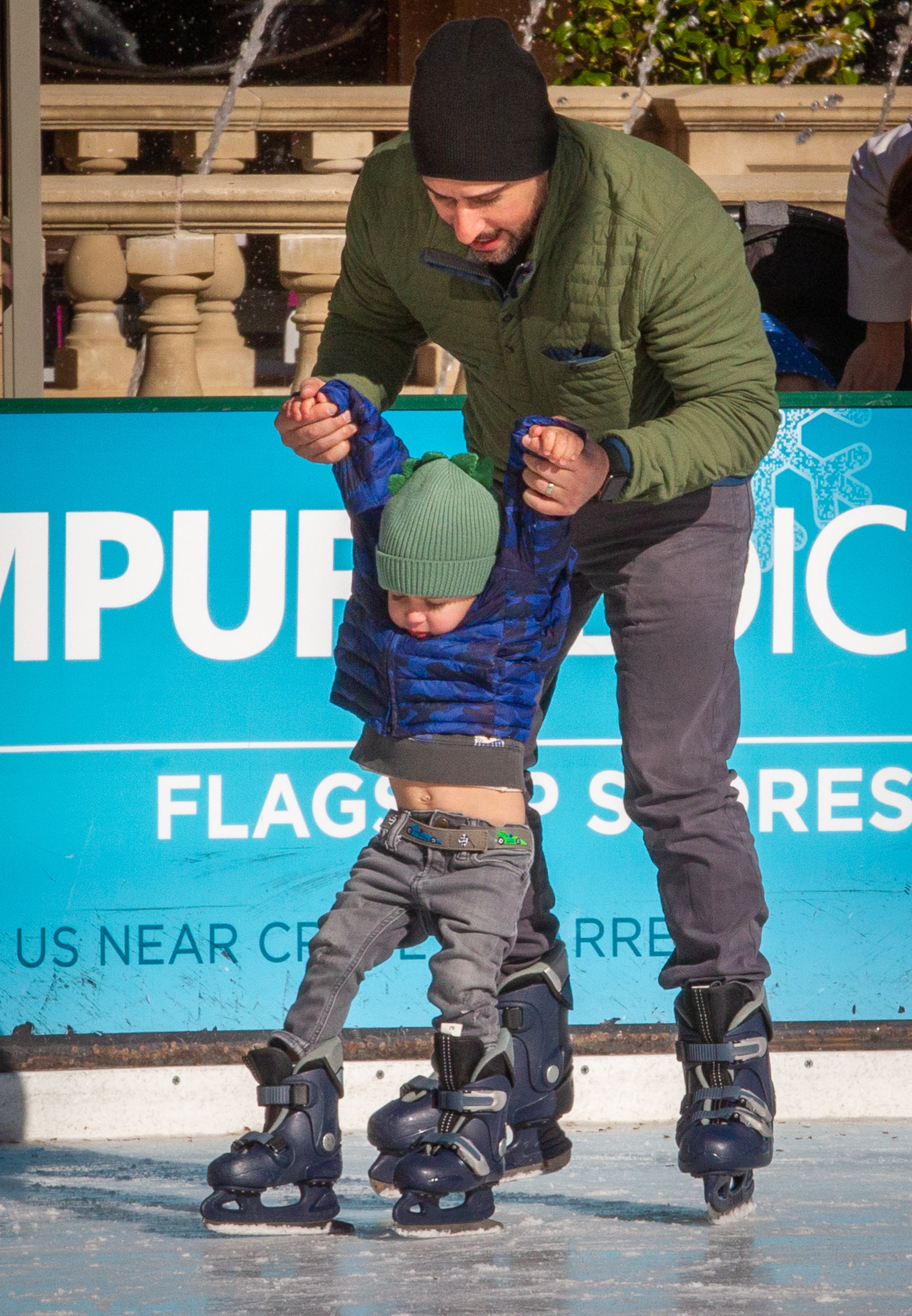 Anthony Gigante and his son Jack, 3, make it around the ice skating rink Avalon on Ice in Alpharetta on Saturday, January 8, 2022. STEVE SCHAEFER FOR THE ATLANTA JOURNAL-CONSTITUTION