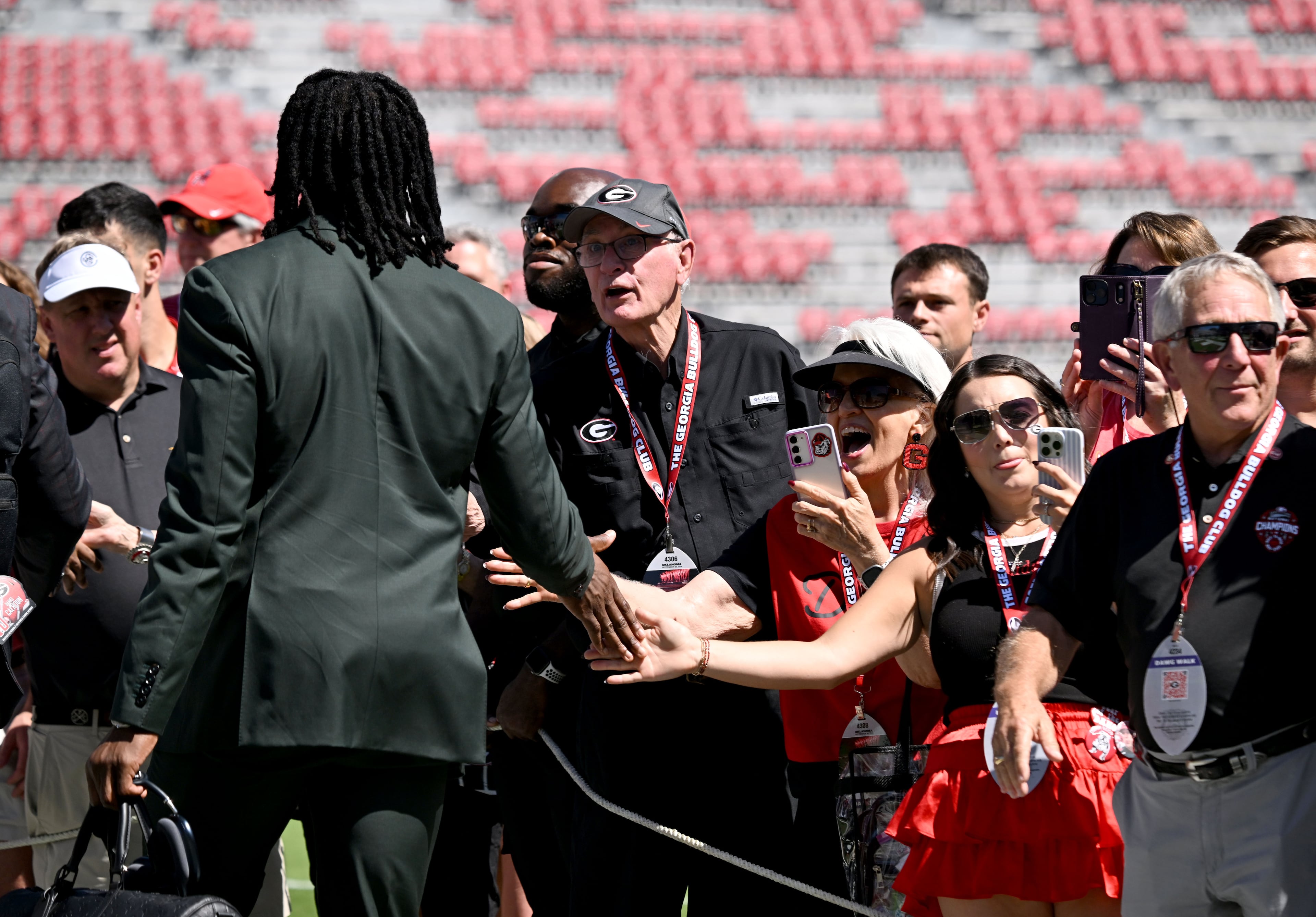 Georgia fans cheer during the Dawg Walk before Georgia's SEC football game against Oklahoma at Sanford Stadium, on Saturday, Sept. 26, 2026, in Athens, Ga. (Hyosub Shin/AJC)
