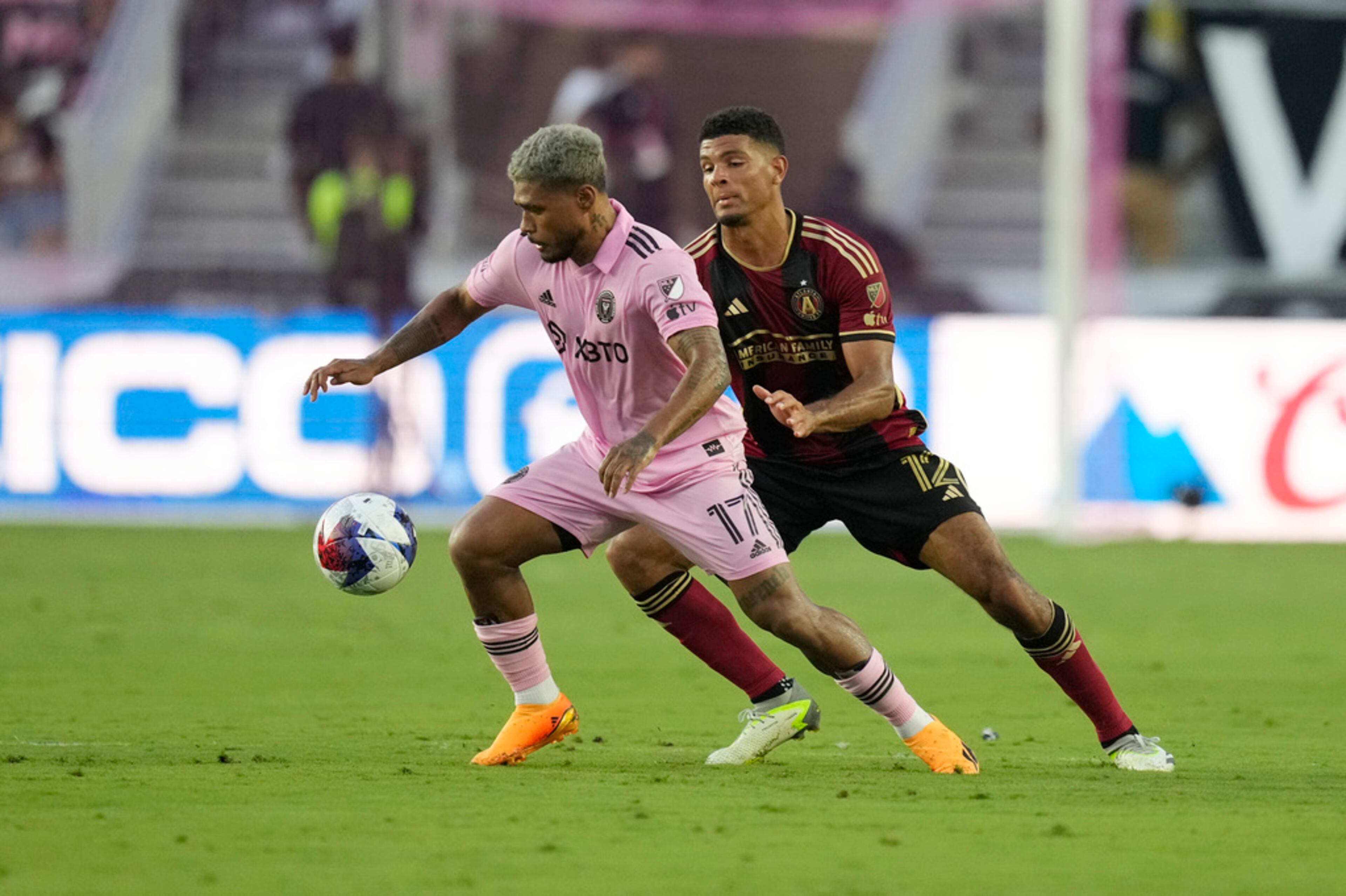 Atlanta United defender Miles Robinson (12) defends Inter Miami forward Josef Martínez (17) during the first half of a Leagues Cup soccer match, Tuesday, July 25, 2023, in Fort Lauderdale, Fla. (AP Photo/Rebecca Blackwell)
