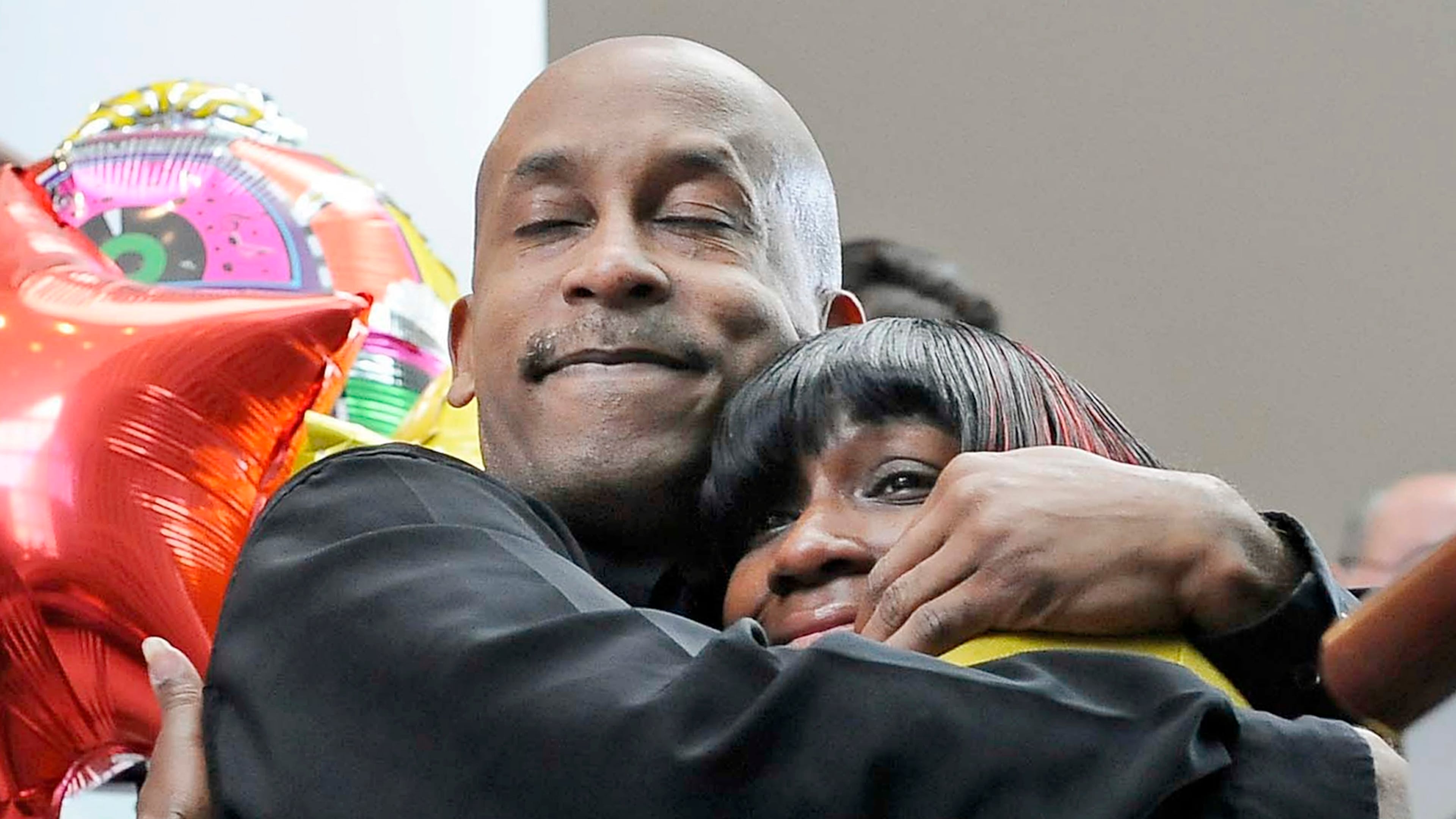 Bone marrow donor Tim Crawford of Adairsville, Ga., hugs Rosalind Beard after the two met each other for the first time at Loyola University Medical Center's annual Bone Marrow Transplant Celebration in Maywood, Ill. Crawford, a full-time student and father of three adult children, donated his stem cells to help the suburban Chicago mother of four fight Hodgkin's lymphoma.