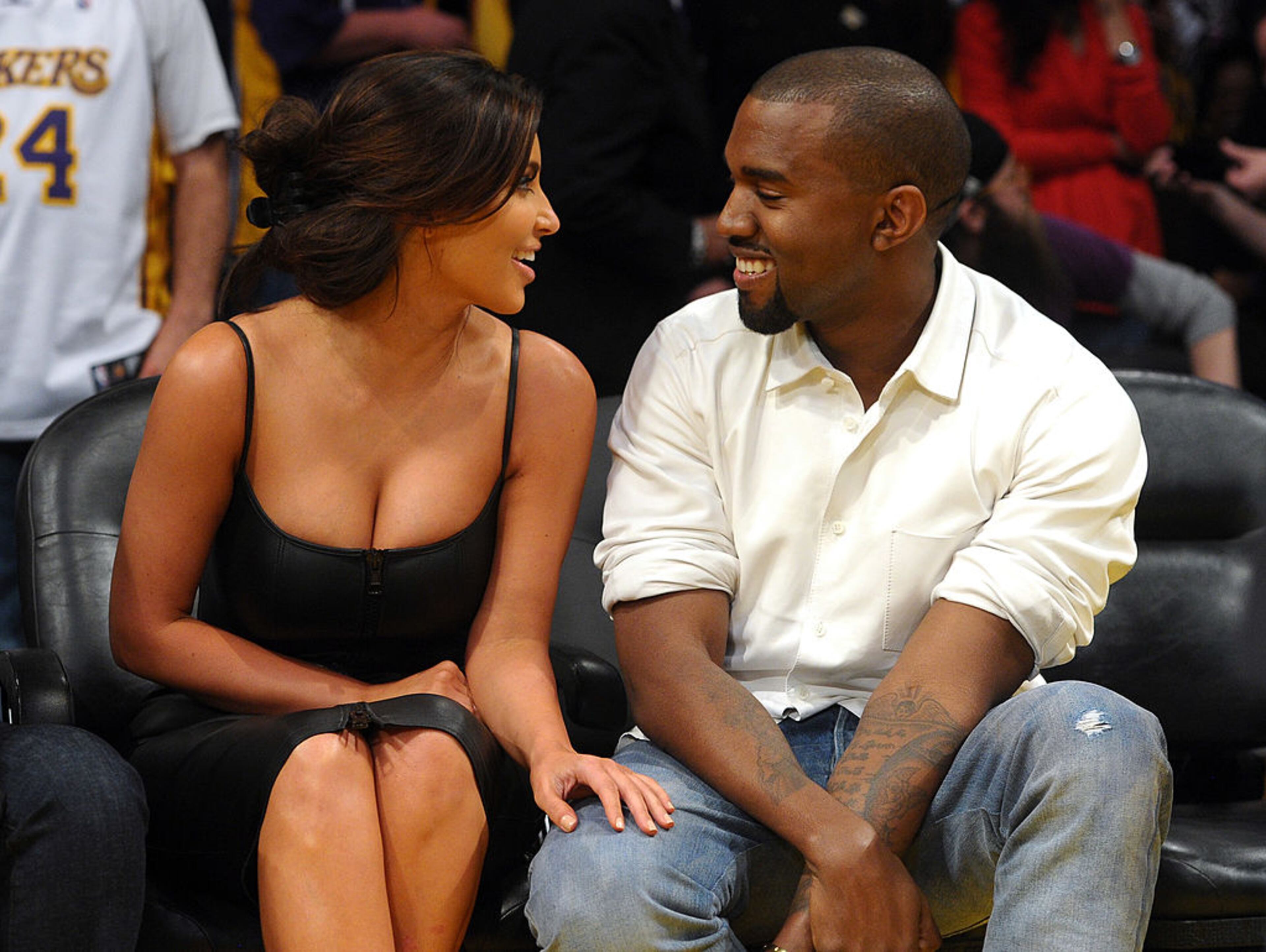 LOS ANGELES, CA - MAY 12: Kim Kardashian and Kanye West talk from their courtside seats before the Los Angeles Lakers take on the Denver Nuggets in Game Seven of the Western Conference Quarterfinals in the 2012 NBA Playoffs on May 12, 2012 at Staples Center in Los Angeles, California. (Photo by Noel Vasquez/Getty Images)