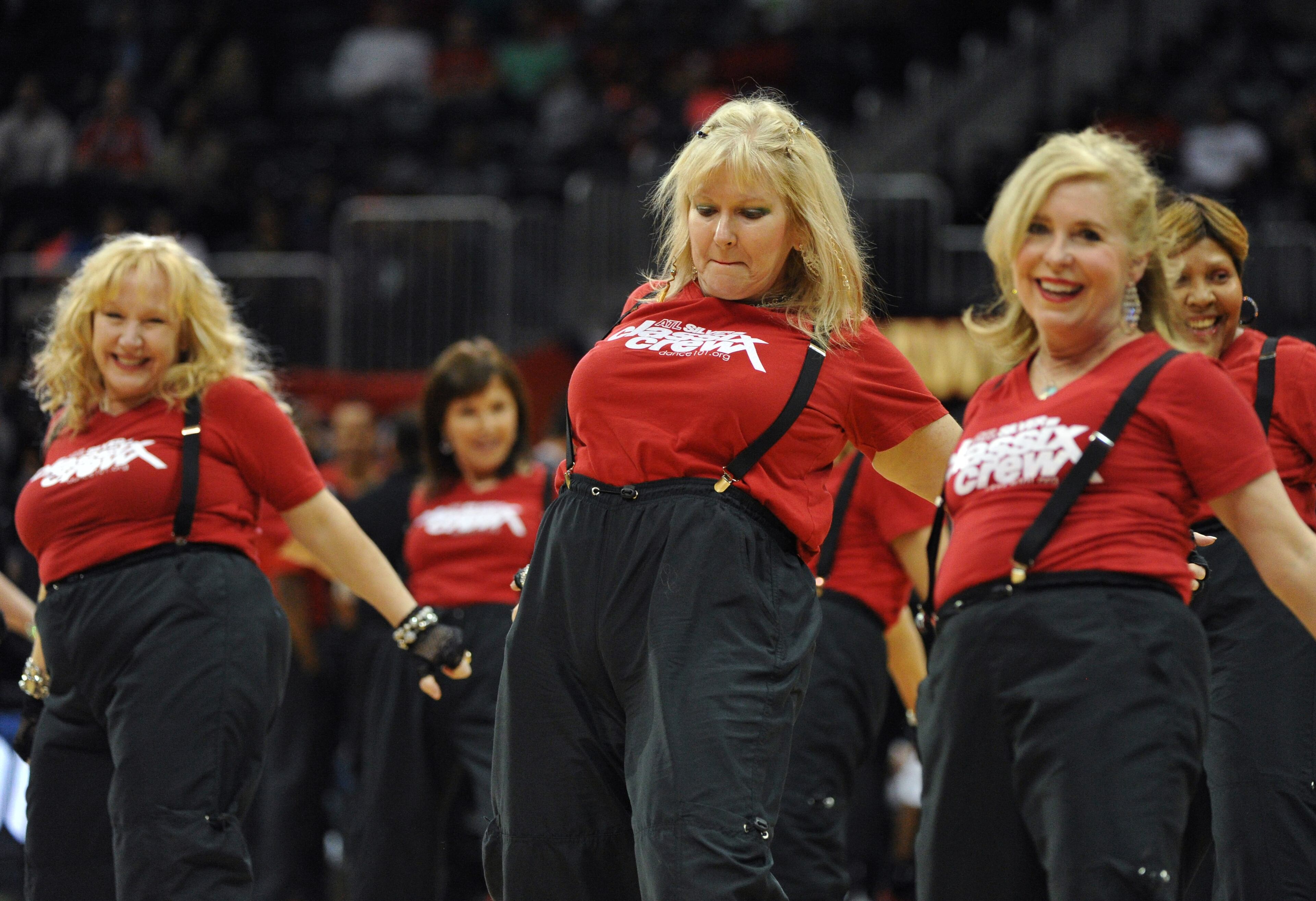 The Silver Classic Crew, a group of mature dancers known for their entertaining moves, performs in the first half of the Atlanta Hawks and Portland Trail Blazers NBA basketball game Thursday, March 27, 2014, in Atlanta. (AP Photo/David Tulis)