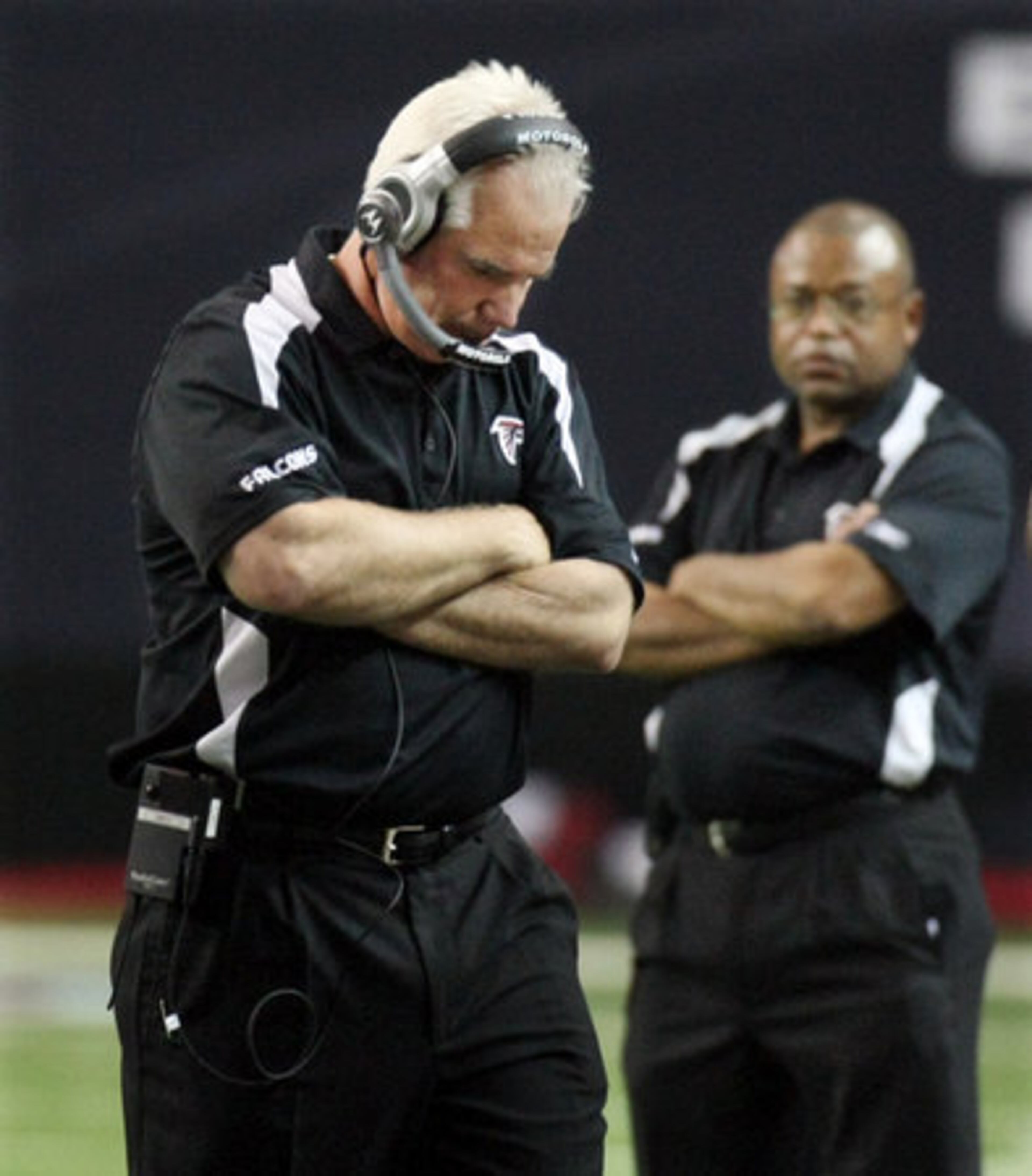 Falcons head coach Mike Smith reacts on the sidelines as the team fails to convert on fourth-down try. Denver took control of the ball with less than a minute left.