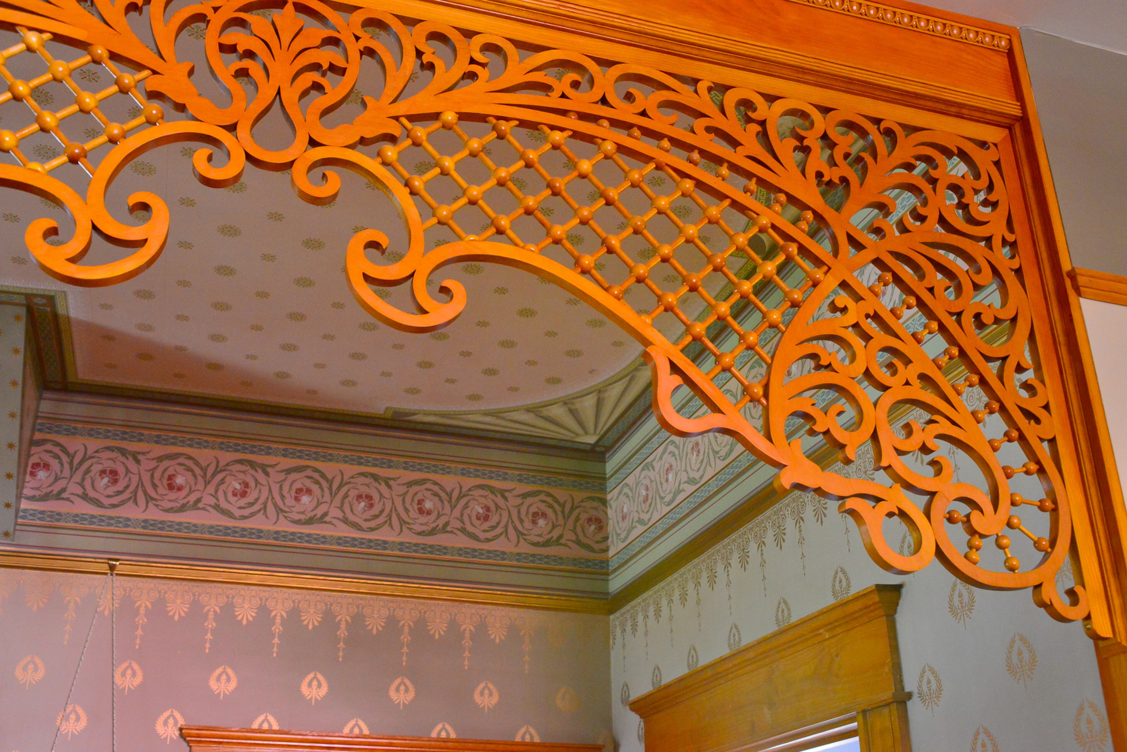 Orange latticework in the foyer leading into the living room - also called the back parlor - was designed by homeowner Mike Dufano. A company made the pieces, but the latticework still needed to be assembled when it arrived.