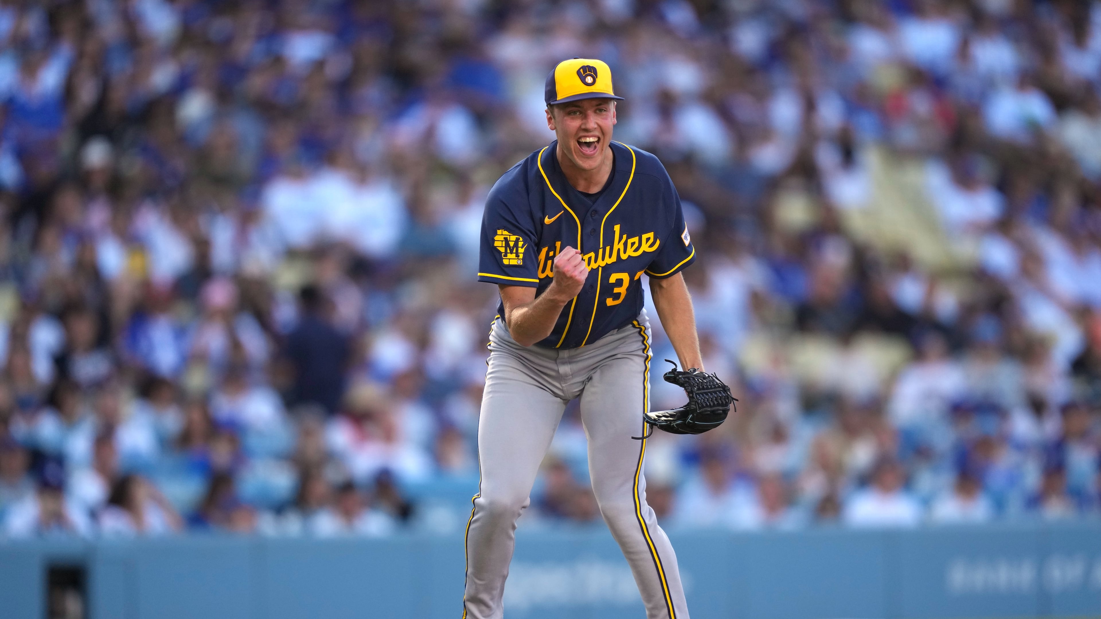Milwaukee Brewers starting pitcher Jacob Misiorowski, left, celebrates after striking out Los Angeles Dodgers' Tommy Edman during the sixth inning of a baseball game Saturday, Aug. 15, 2026, in Los Angeles. (AP Photo/Mark J. Terrill)