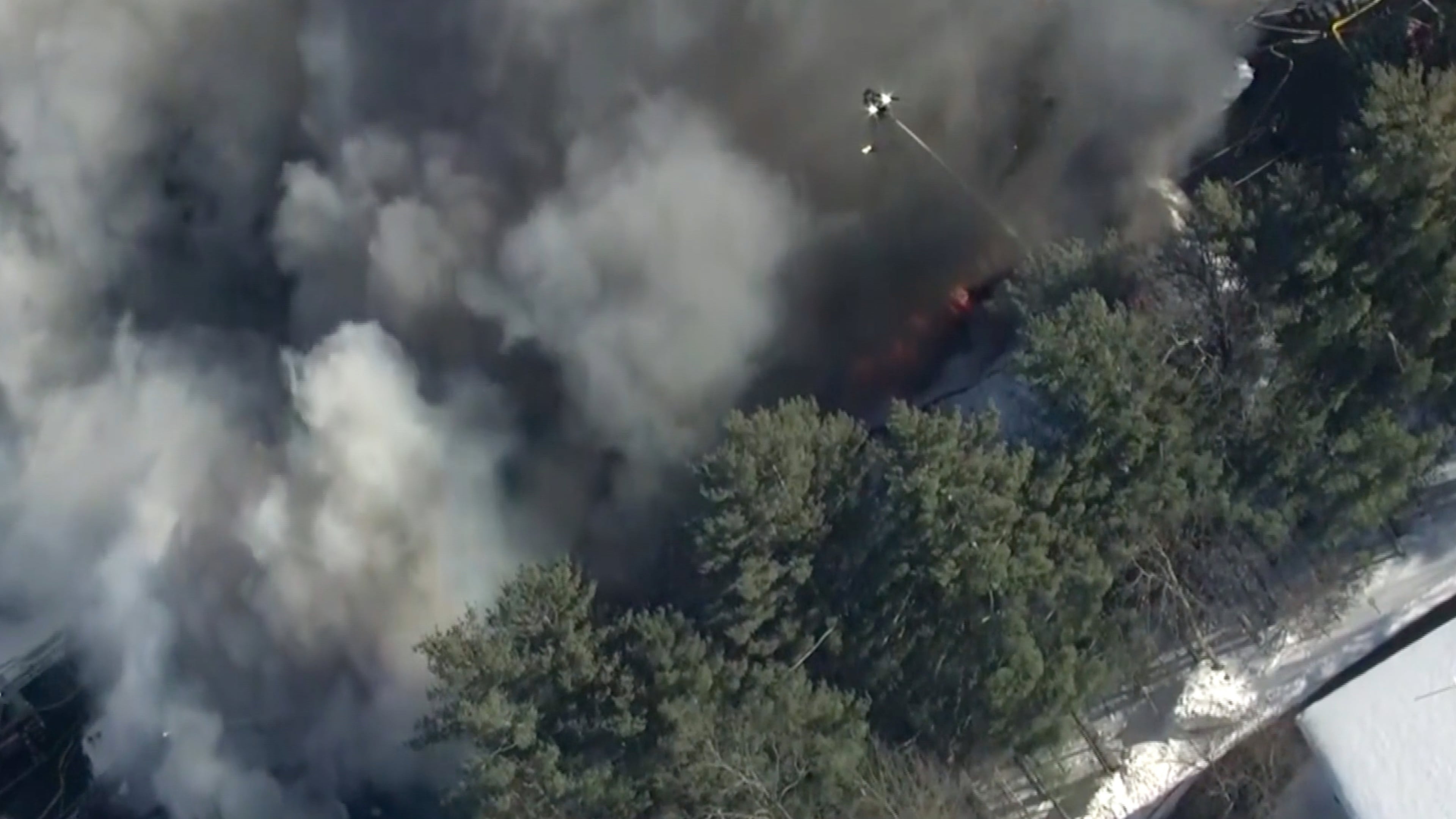 This image made from video provided by WCVB-TV shows an ongoing fire following a natural gas explosion inside a building in Nashua, N.H., Monday, Feb. 2, 2026. (WCVB-TV via AP)