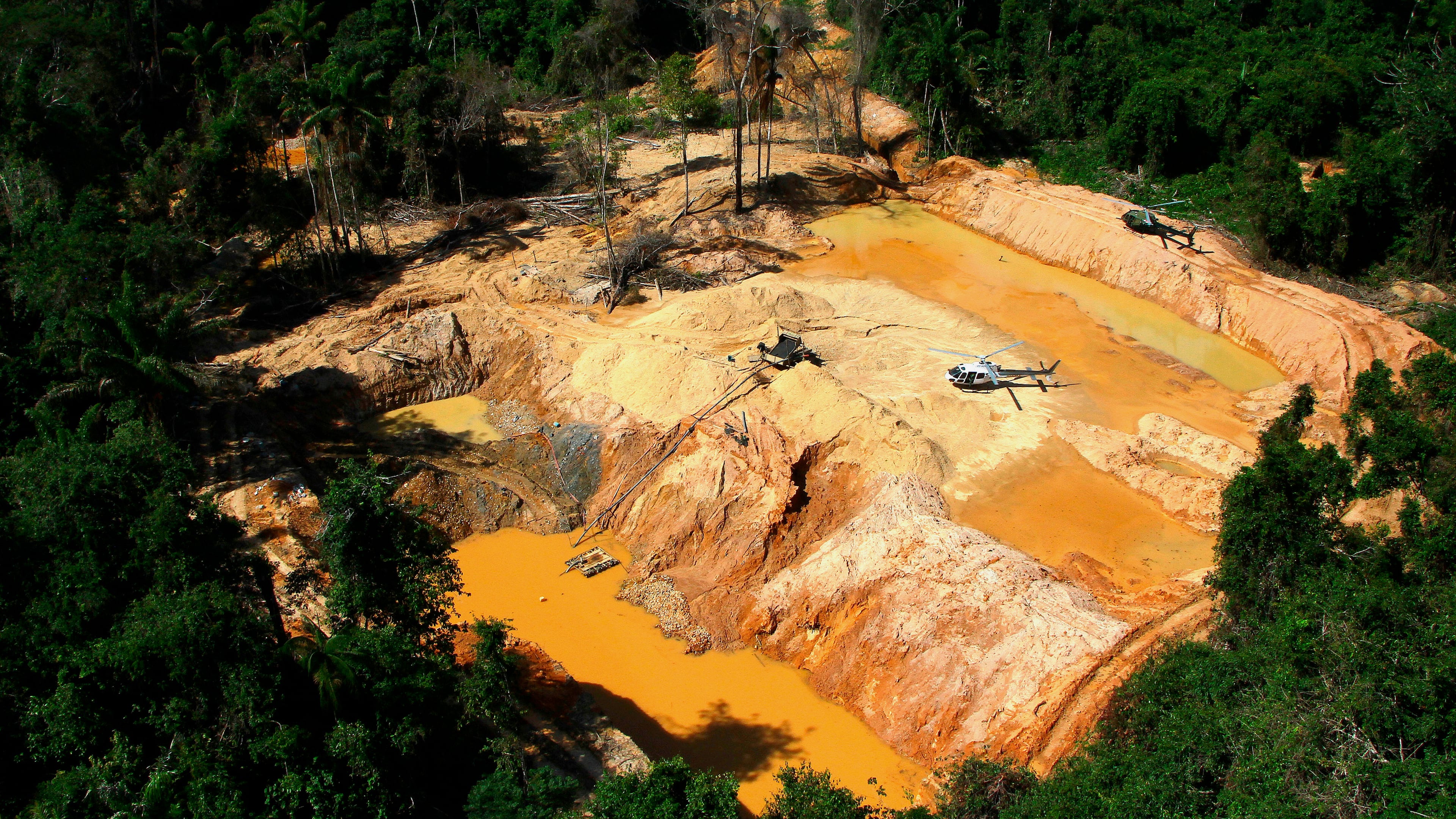FILE - An illegal mining camp is visible from a Brazil Environmental Agency helicopter during an operation to try to contain illegal mining in Yanomami Indigenous territory, Roraima state, Brazil, Feb. 11, 2023. (AP Photo/Edmar Barros, File)