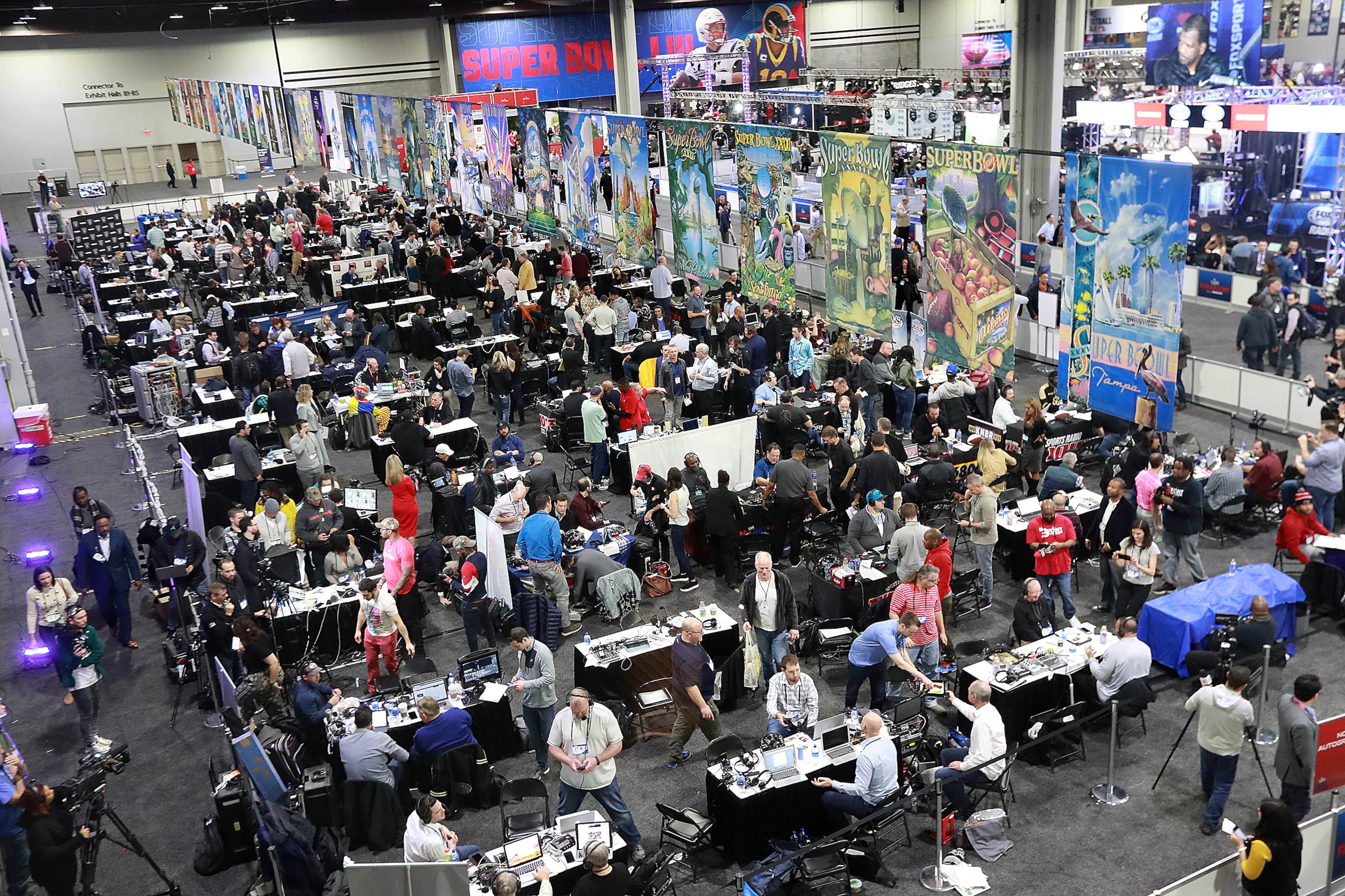 Jan. 31, 2019 Atlanta: Radio row, filled with tables of live broadcasters, is a buzz of activity in the Georgia World Congress Center on Thursday, Jan. 31, 2019, in Atlanta.