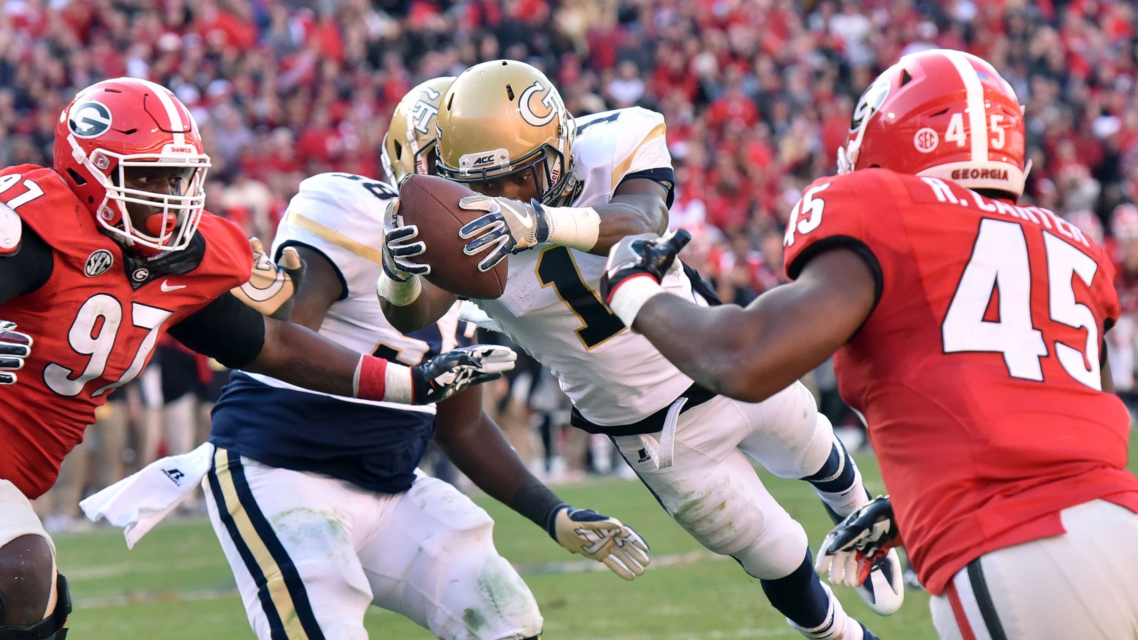 Georgia Tech A-back Qua Searcy dives into the end zone for the winning touchdown at Sanford Stadium on Saturday, Nov. 26, 2016. Tech beat Georgia 28-27. HYOSUB SHIN / HSHIN@AJC.COM