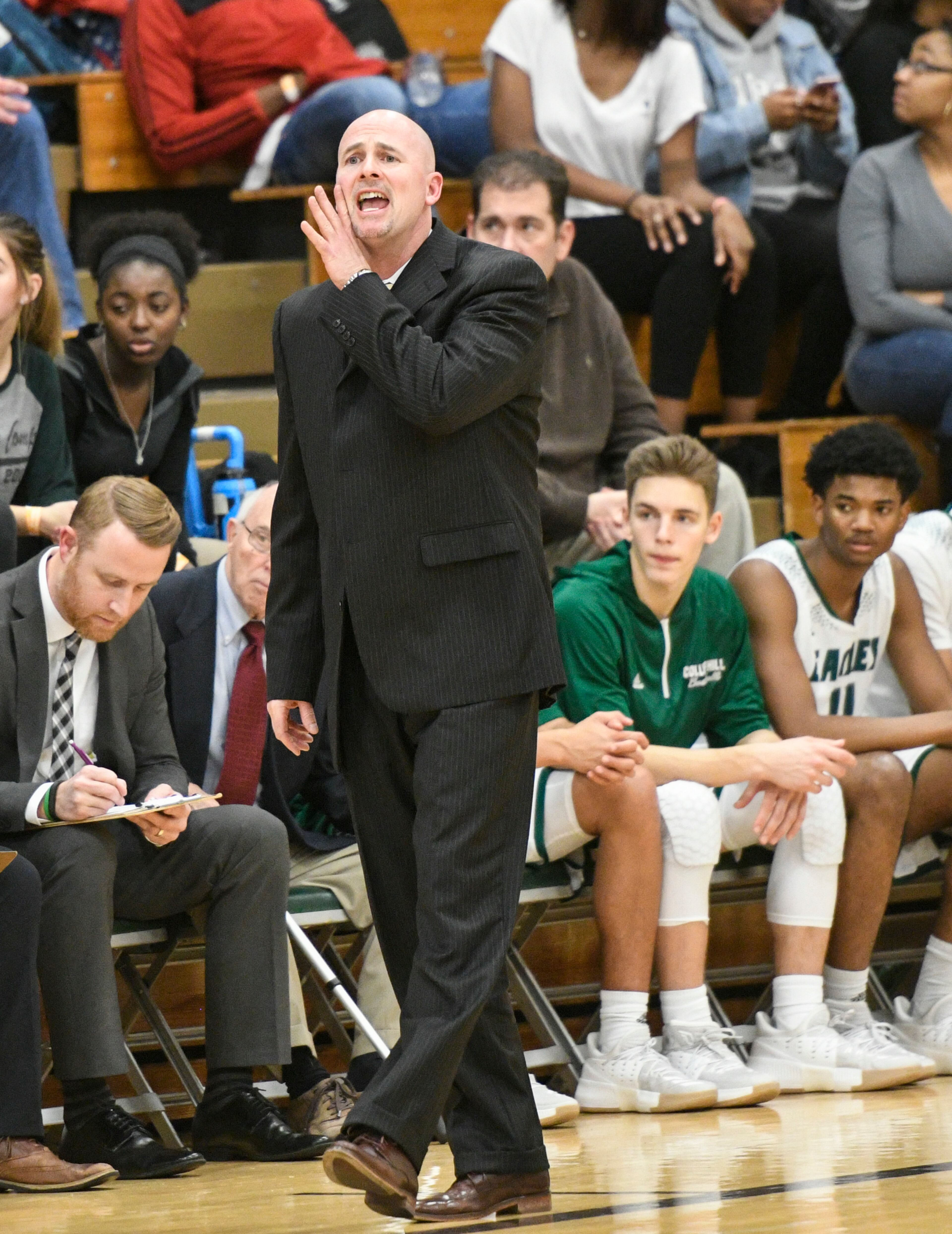 Collins Hill coach Ty Baumgardner works the sideline against Peachtree Ridge during a high school basketball game on Friday, Jan.12, 2018, in Suwanee, Ga. (John Amis)