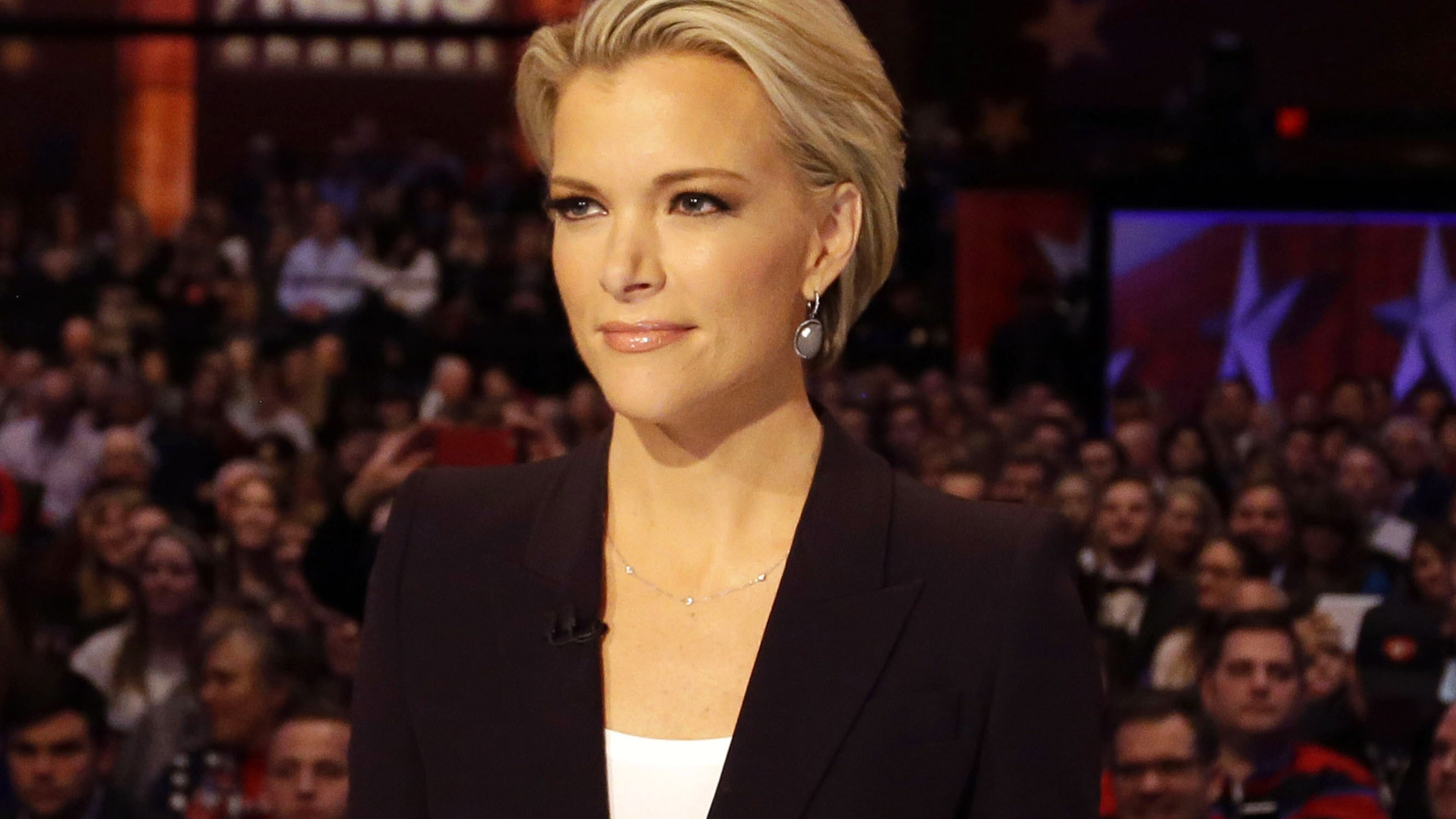 In this Jan. 28, 2016, photo, moderator Megyn Kelly waits for the start of the Republican presidential primary debate in Des Moines, Iowa.