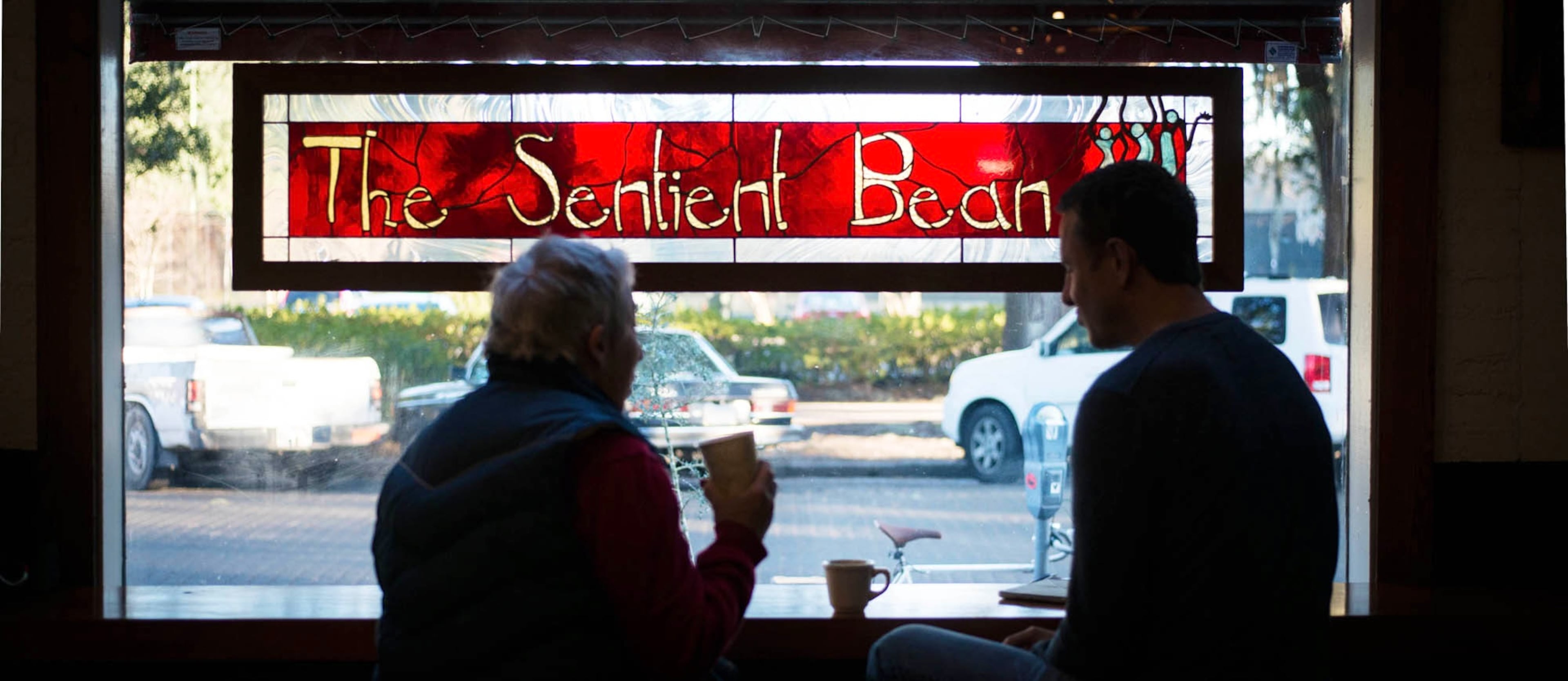 Author Jane Fishman and her friend Brad Baugh enjoy a cup at The Sentient Bean in 2016. (Photo by Imke Lass, courtesy of The Sentient Bean)