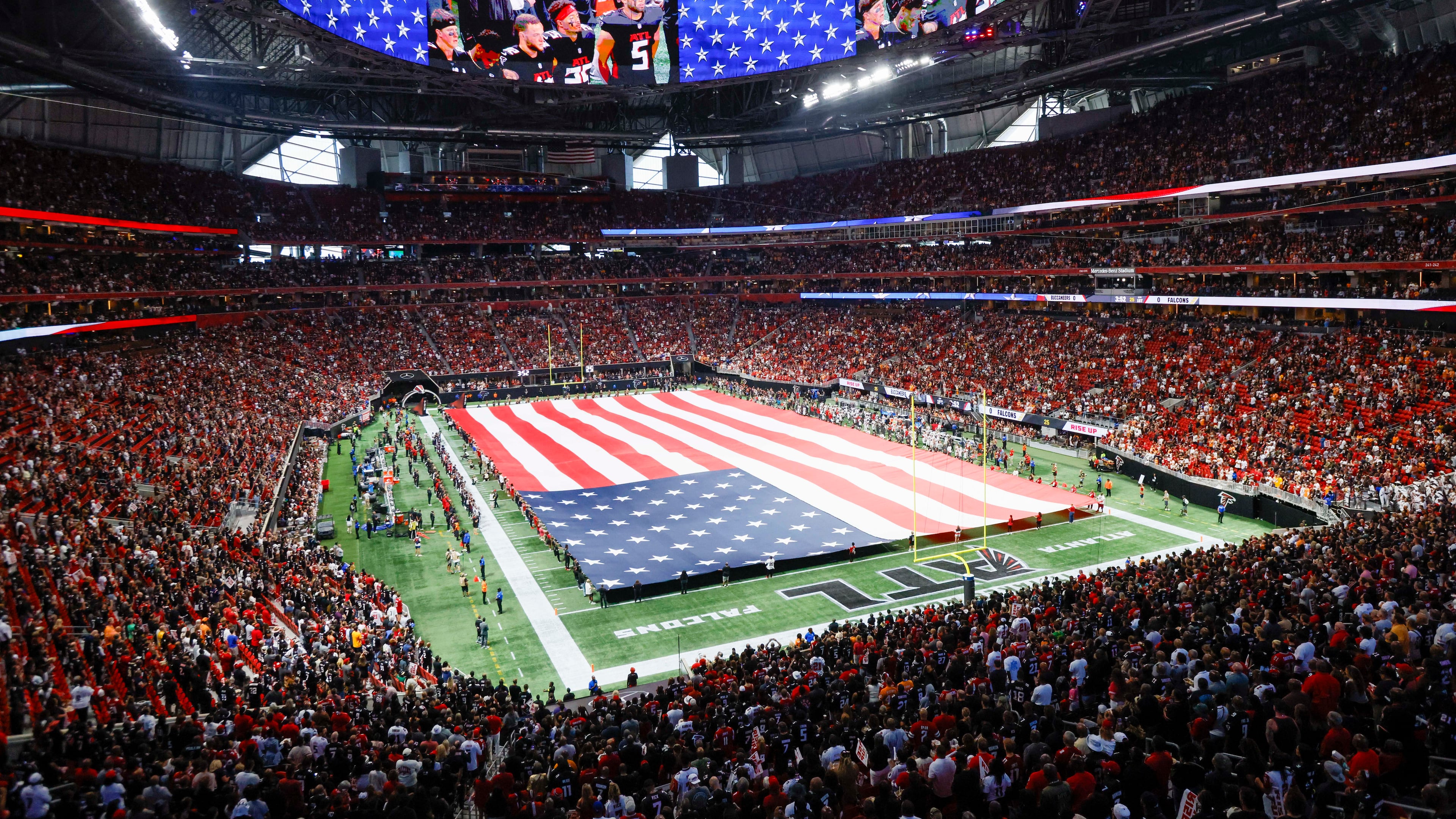 The American flag is displayed during the national anthem prior to the home opener game between the Atlanta Falcons and the Tampa Bay Buccaneers at Mercedes-Benz Stadium on Sunday, September 7, 2025, in Atlanta. (Miguel Martinez/ AJC)