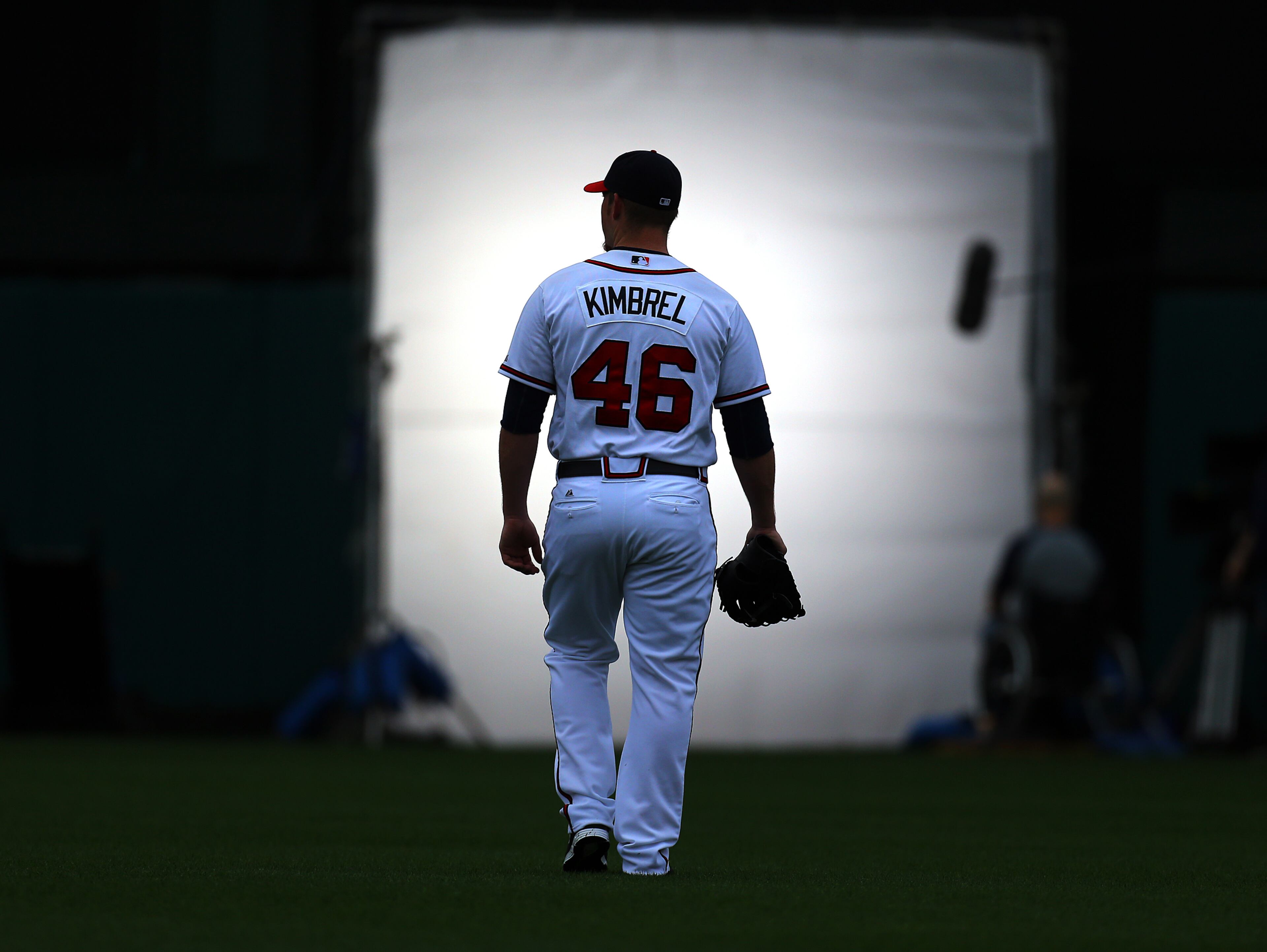 2014: Braves closer Craig Kimbrel walks across the stadium field toward a giant light box to film a t.v. spot before team practice begins at sunrise on Friday, Feb. 21, 2014, in Lake Buena Vista, FL. CURTIS COMPTON / CCOMPTON@AJC.COM