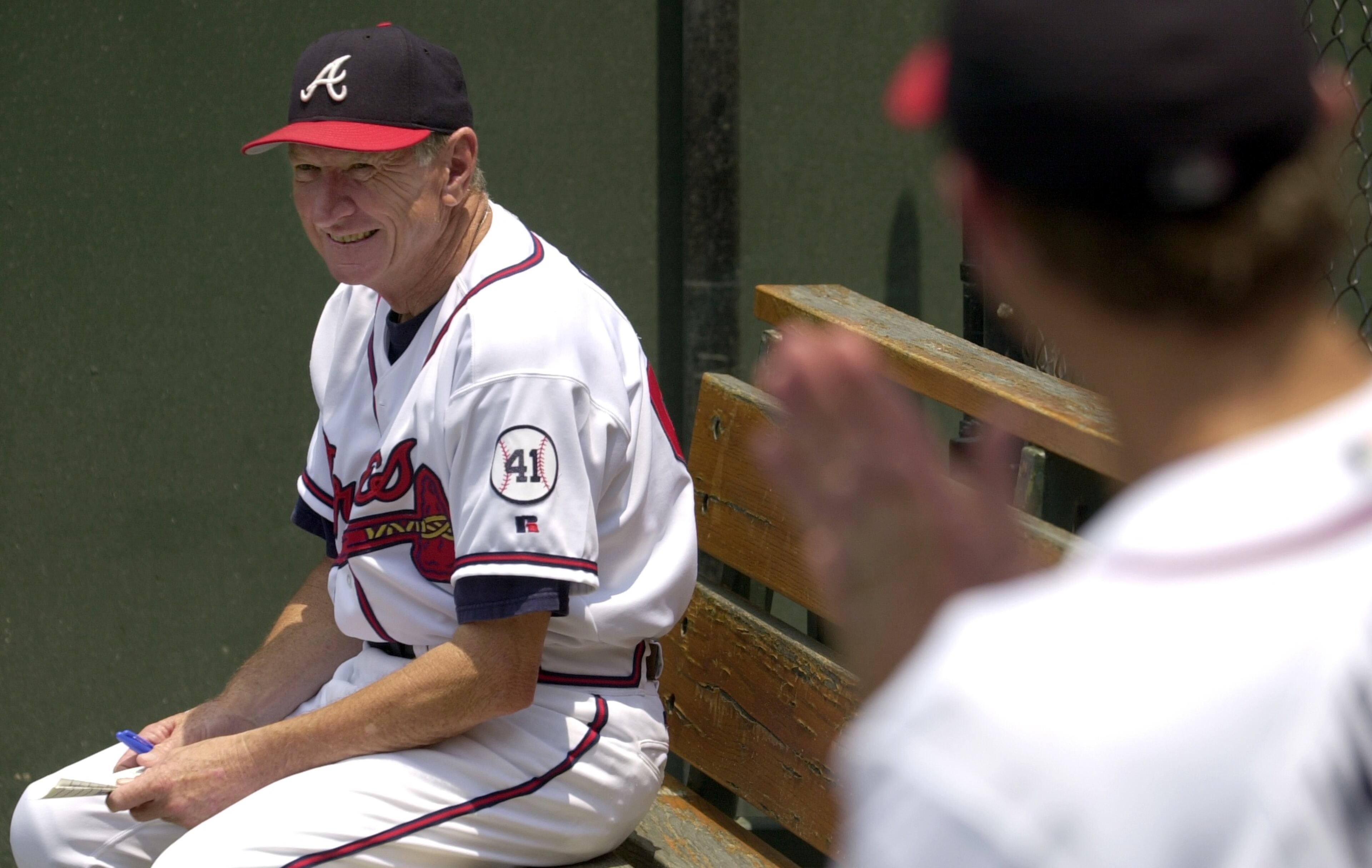 010626 ATLANTA, GA.: Braves bullpen coach Bob Dews keeps an eye on braves pitchers at a game against the Florida Marlins. (SUNNY SUNG/STAFF)