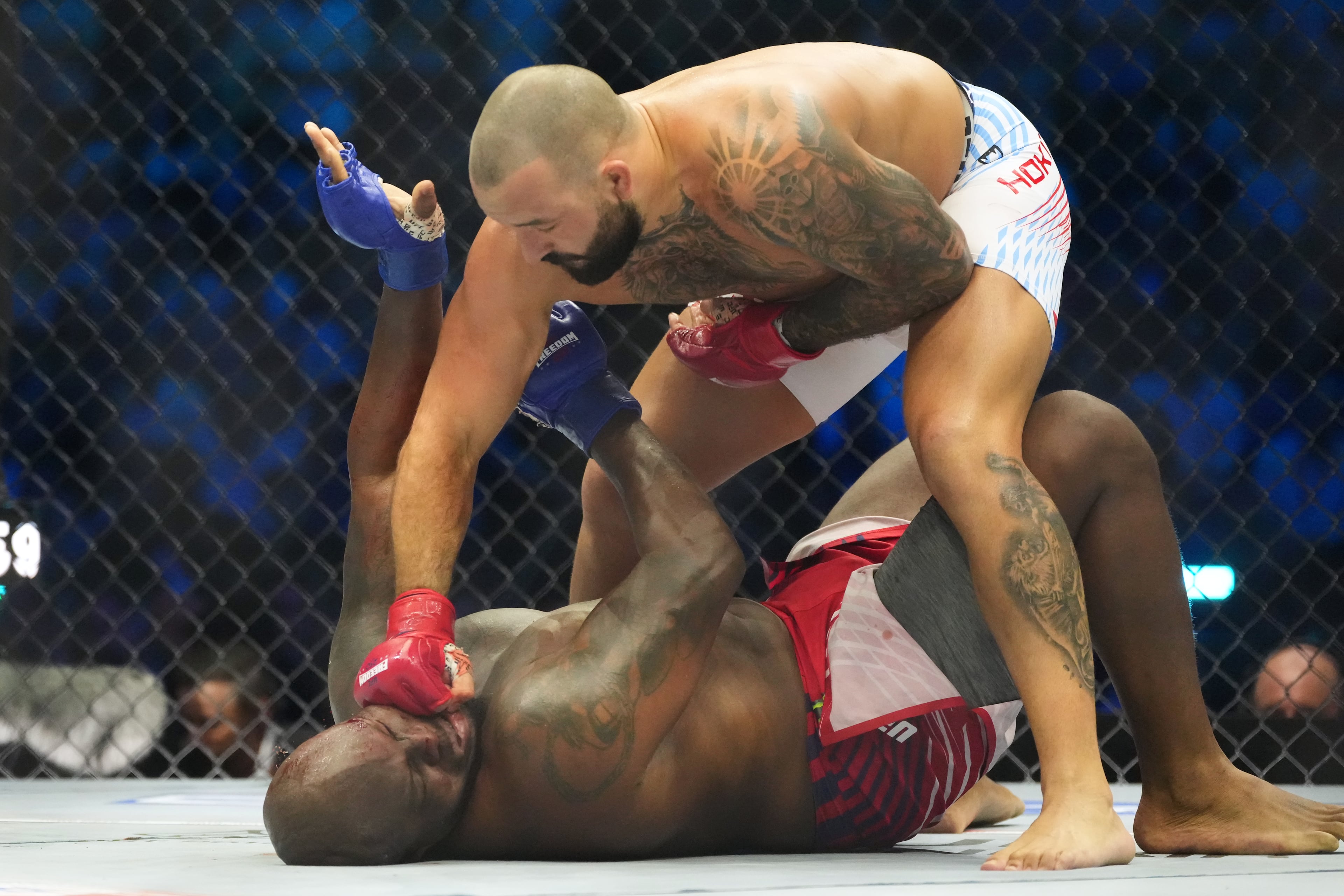 Josh Hokit lands a punch as he fights Derrick Lewis during their heavyweight bout at UFC Freedom 250 on the South Lawn of the White House on Sunday, June 14, 2026, in Washington. (Alex Brandon/AP)