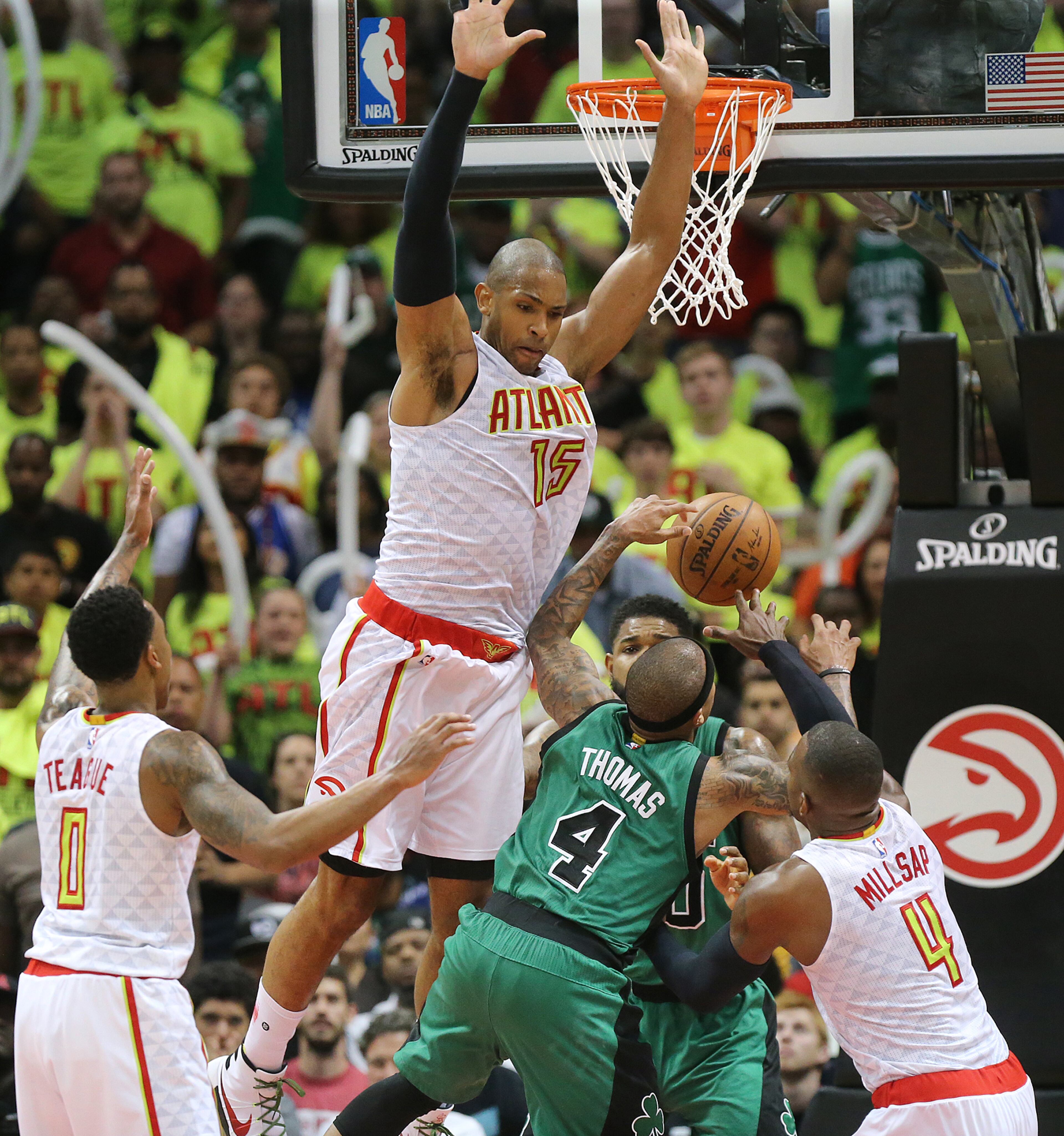 041616 ATLANTA: Hawks Jeff Teague (from left), Al Horford, and Paul Millsap triple team Isaiah Thomas in the final minutes holding on to beat the Celtics 102-101 in game one of their NBA Eastern Conference first round playoff game at Philips Arena on Saturday, April 16, 2016. Curtis Compton / ccompton@ajc.com