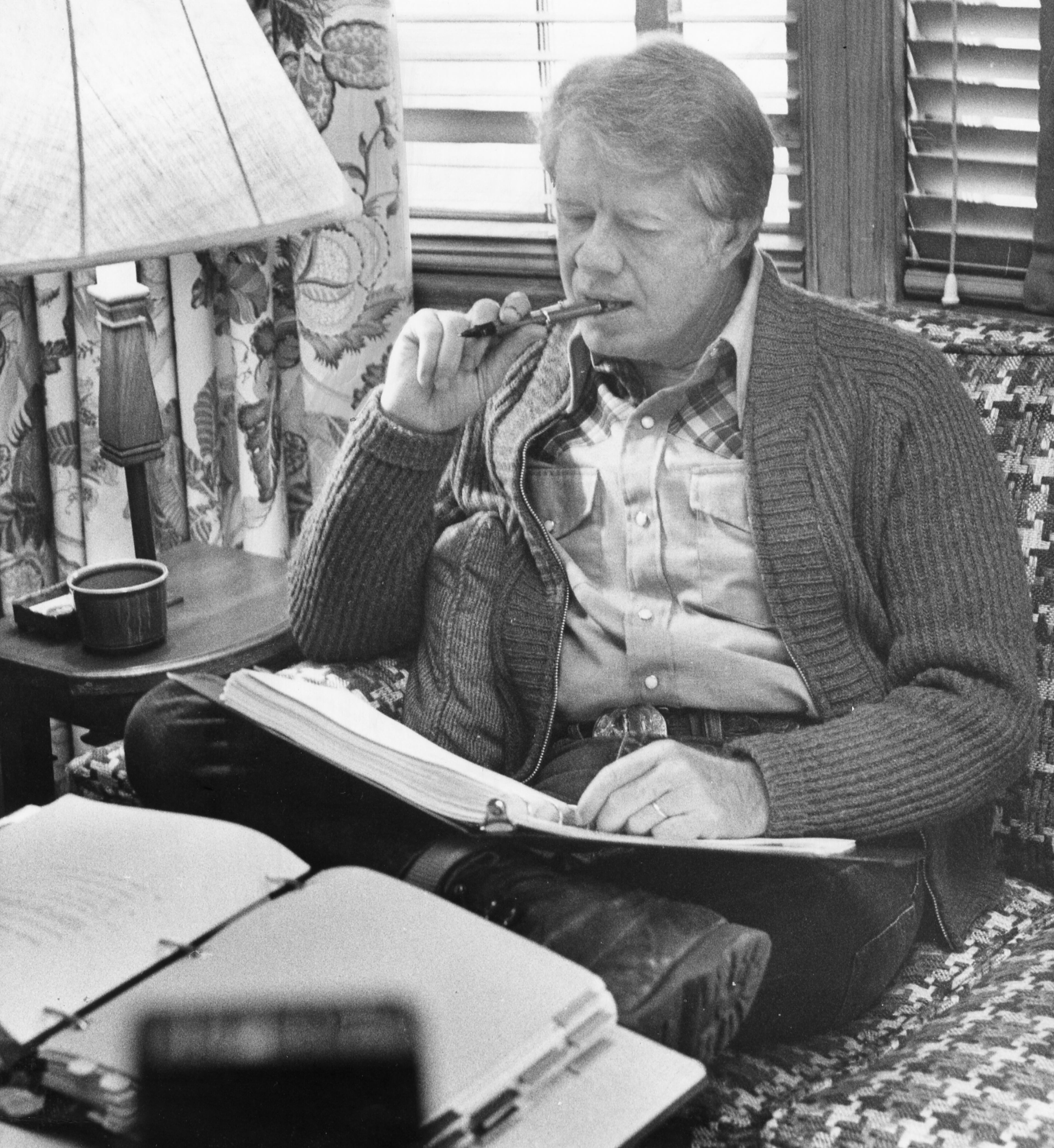 President-elect Jimmy Carter reviews transition papers Nov. 10, 1976, at his cottage at Musgrove on St. Simons Island.