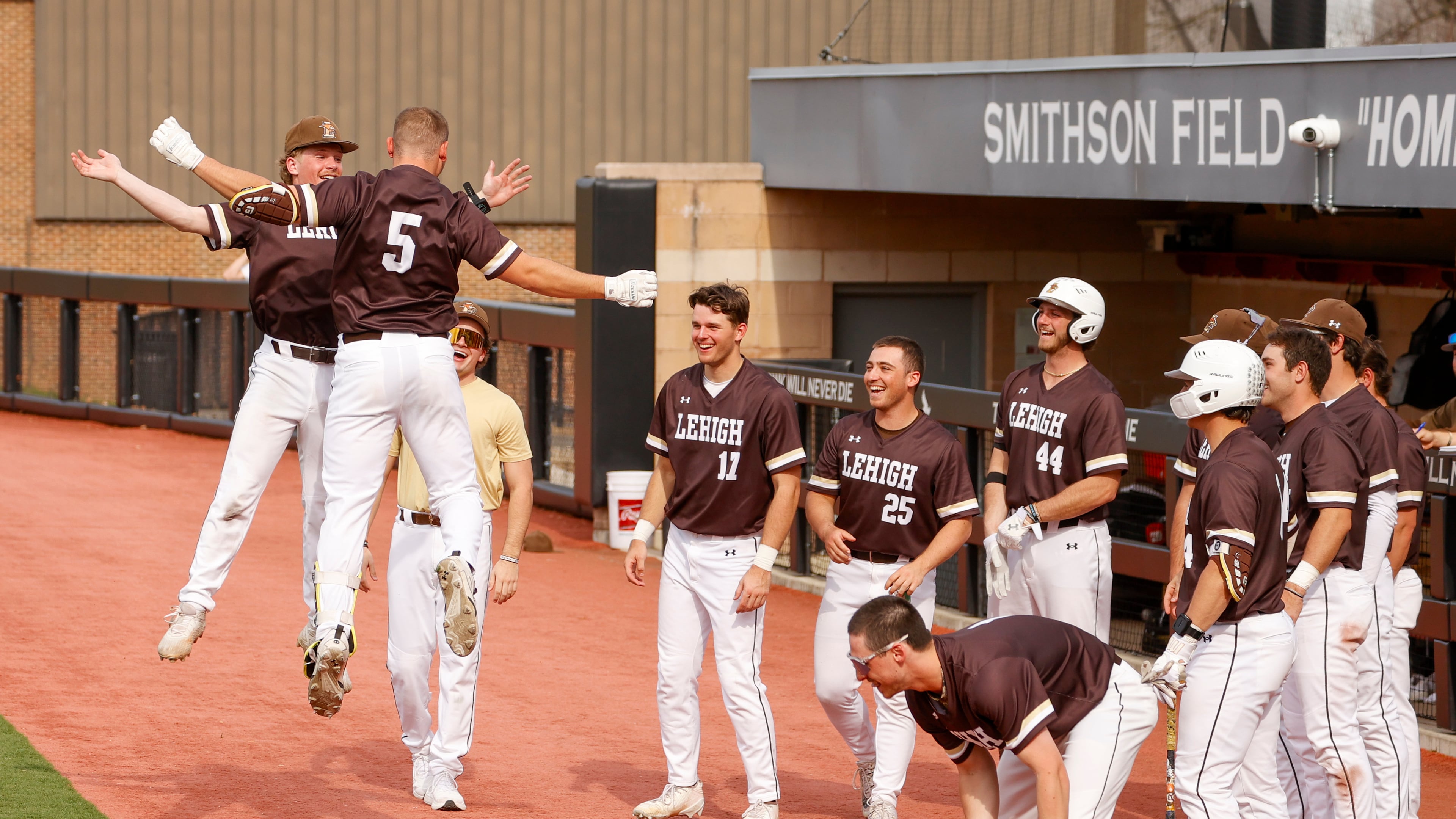 FILE - Lehigh catcher Owen Walewander (5) celebrates with his teammates after hitting a three-run home run against Saint Joseph's in the third inning during an NCAA college baseball game, March 31, 2026, in Philadelphia. (AP Photo/Jason E. Miczek, File)