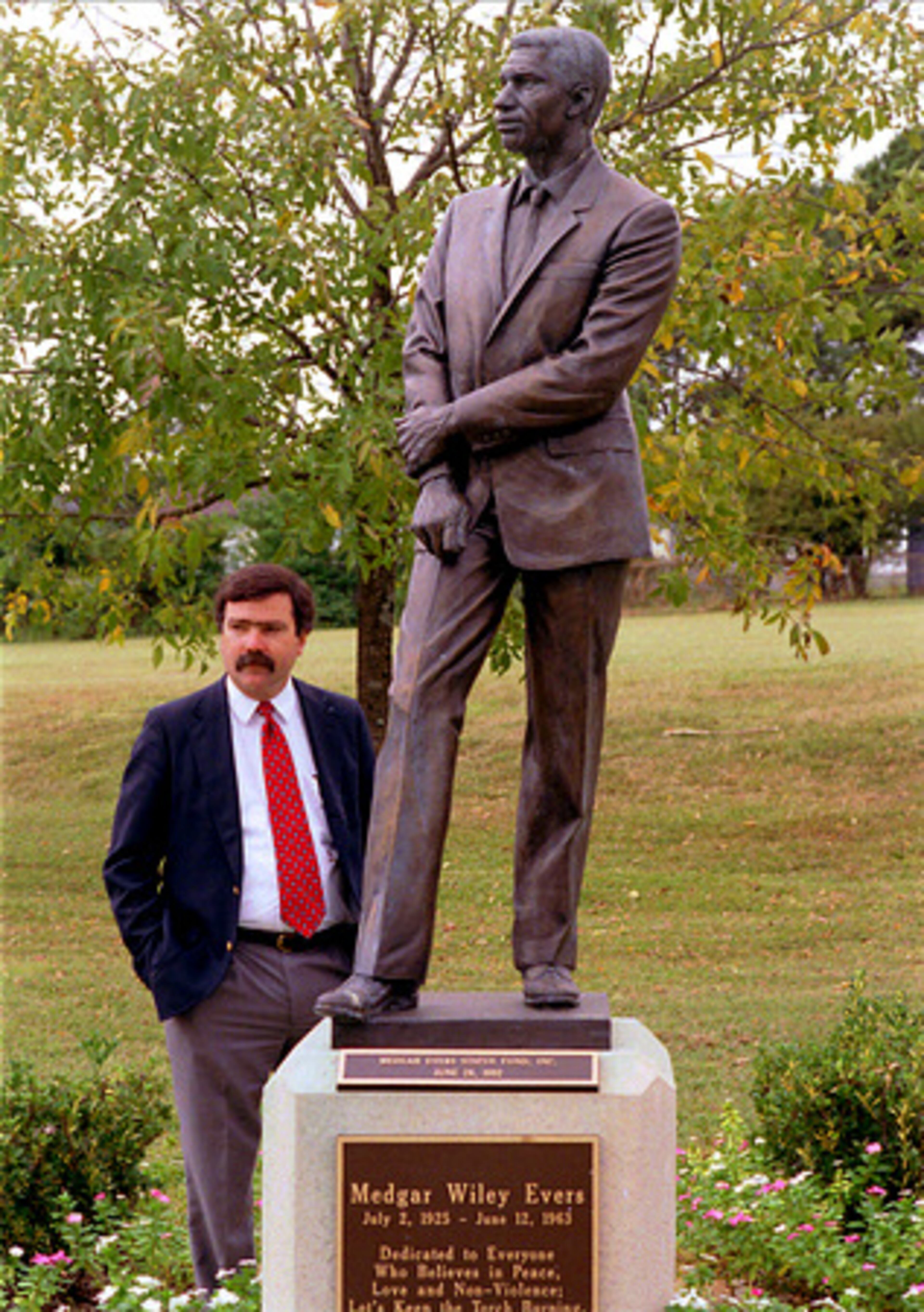 The statue of slain civil rights leader Medgar Evers looks over Medgar Evers Boulevard in northeast Jackson, Miss. The man in the photo, Assistant Hinds County district attorney Bobby DeLaughter, led the successful prosecution of Evers' killer, Byron De La Beckwith, in a 1994 trail, 30 years after the murder in June 1963.