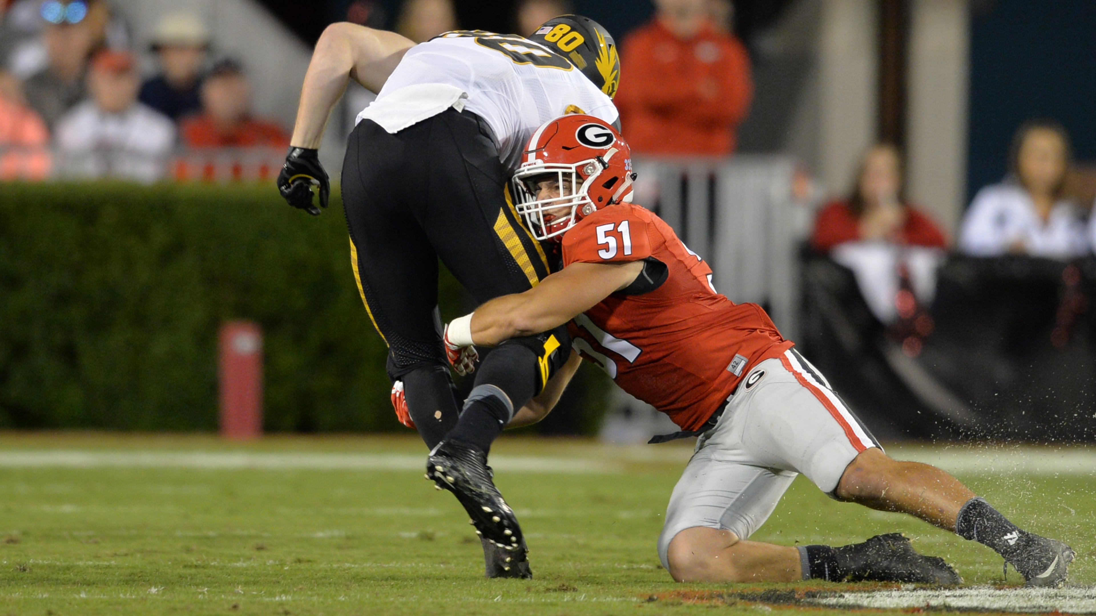 Former Georgia linebacker Jake Ganus (right), who played for the Bulldogs during the 2015 season, has been suspended by the Alabama High School Athletic Association and is not permitted to coach for the upcoming season. (Brant Sanderlin/AJC 2015)