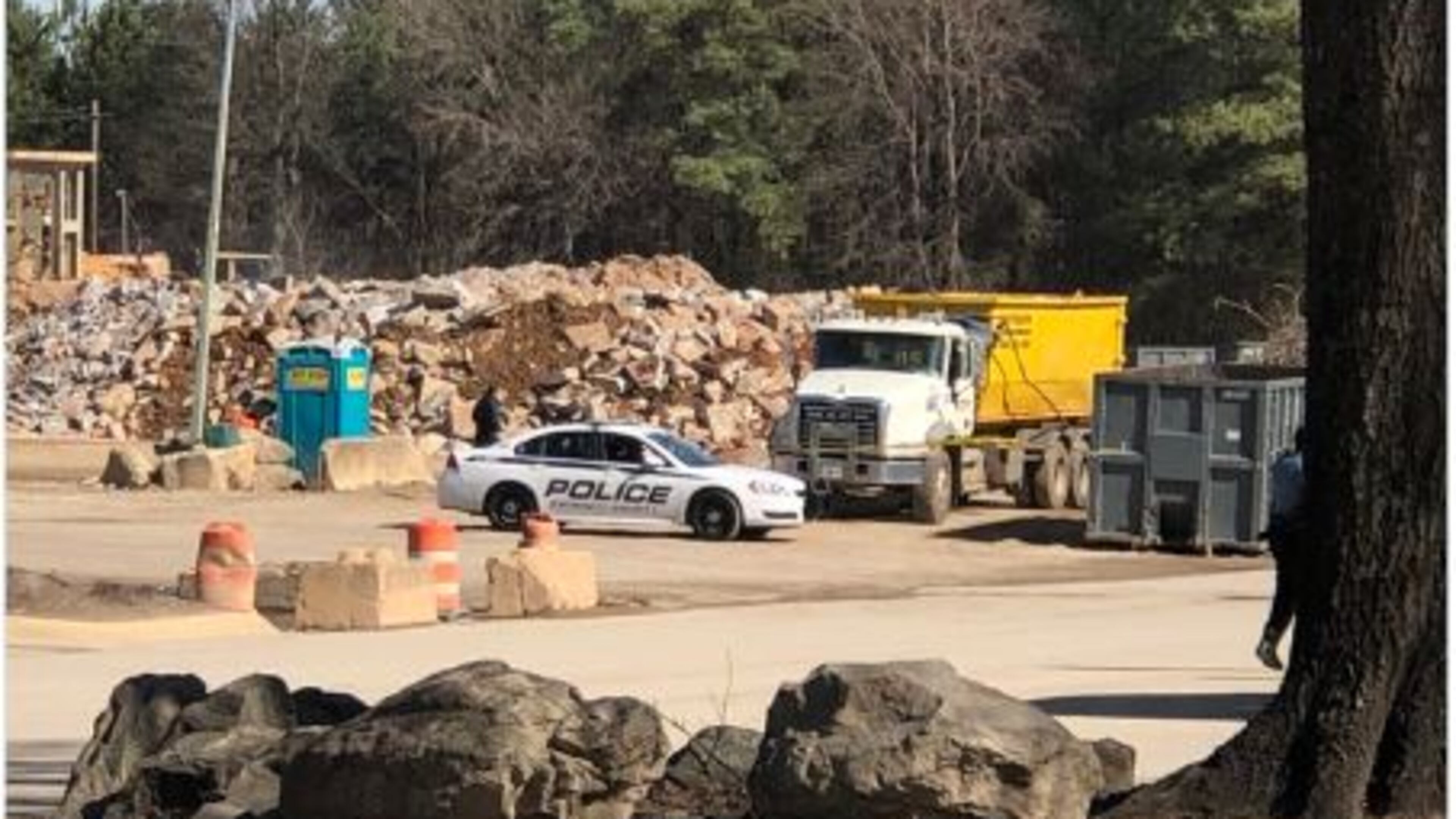 Police said the driver shot outside a Doraville recycling plant last week remains in the hospital in serious condition.