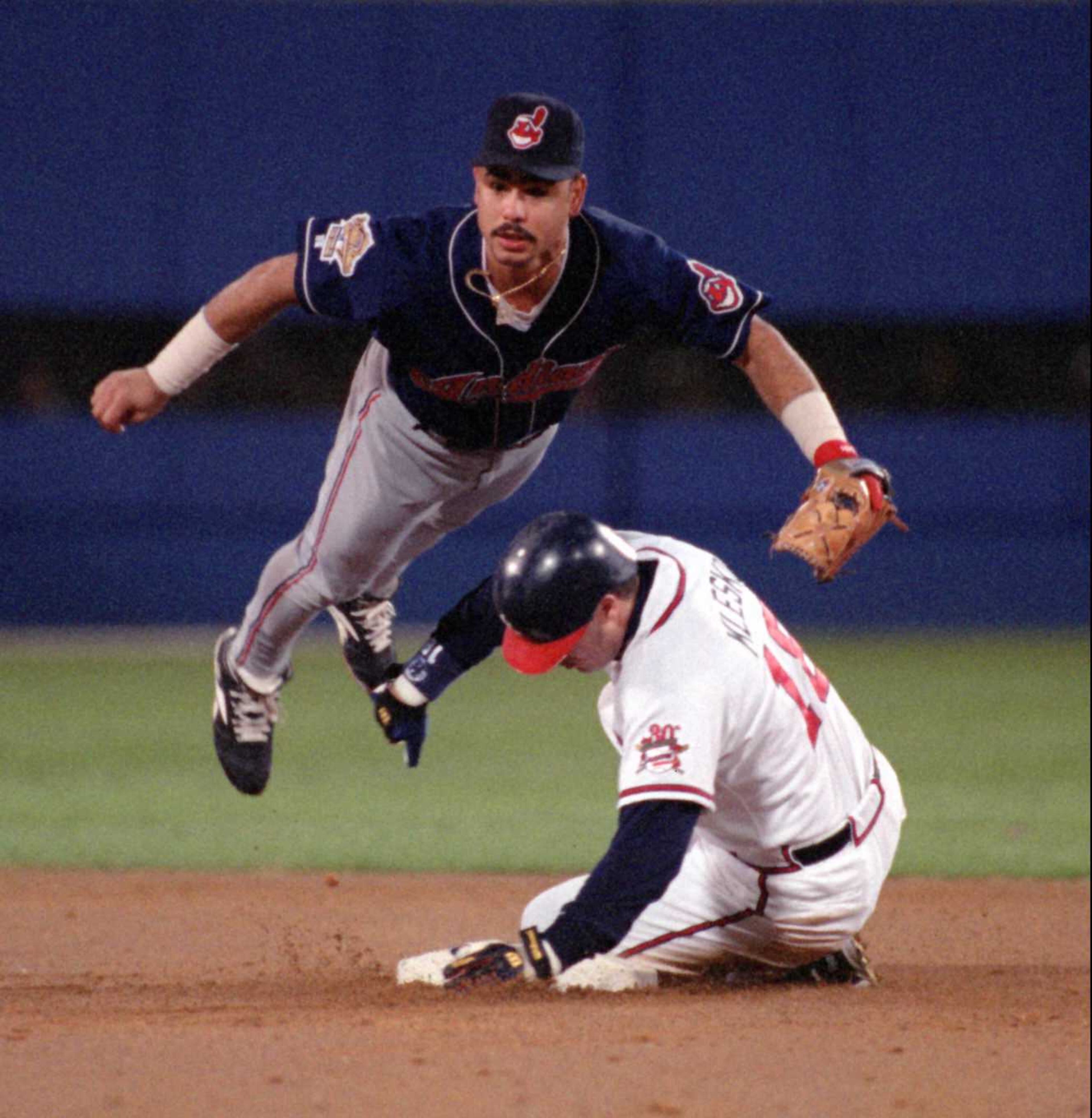 OCTOBER 28, 1995 ATLANTA WORLD SERIES GAME 6 10/28/95: Indians Carlos Baerga is airborne as Ryan Klesko is out at 2nd base in the 2nd inning on a Belliard double play. FRANK NEIMEIR/AJC STAFF