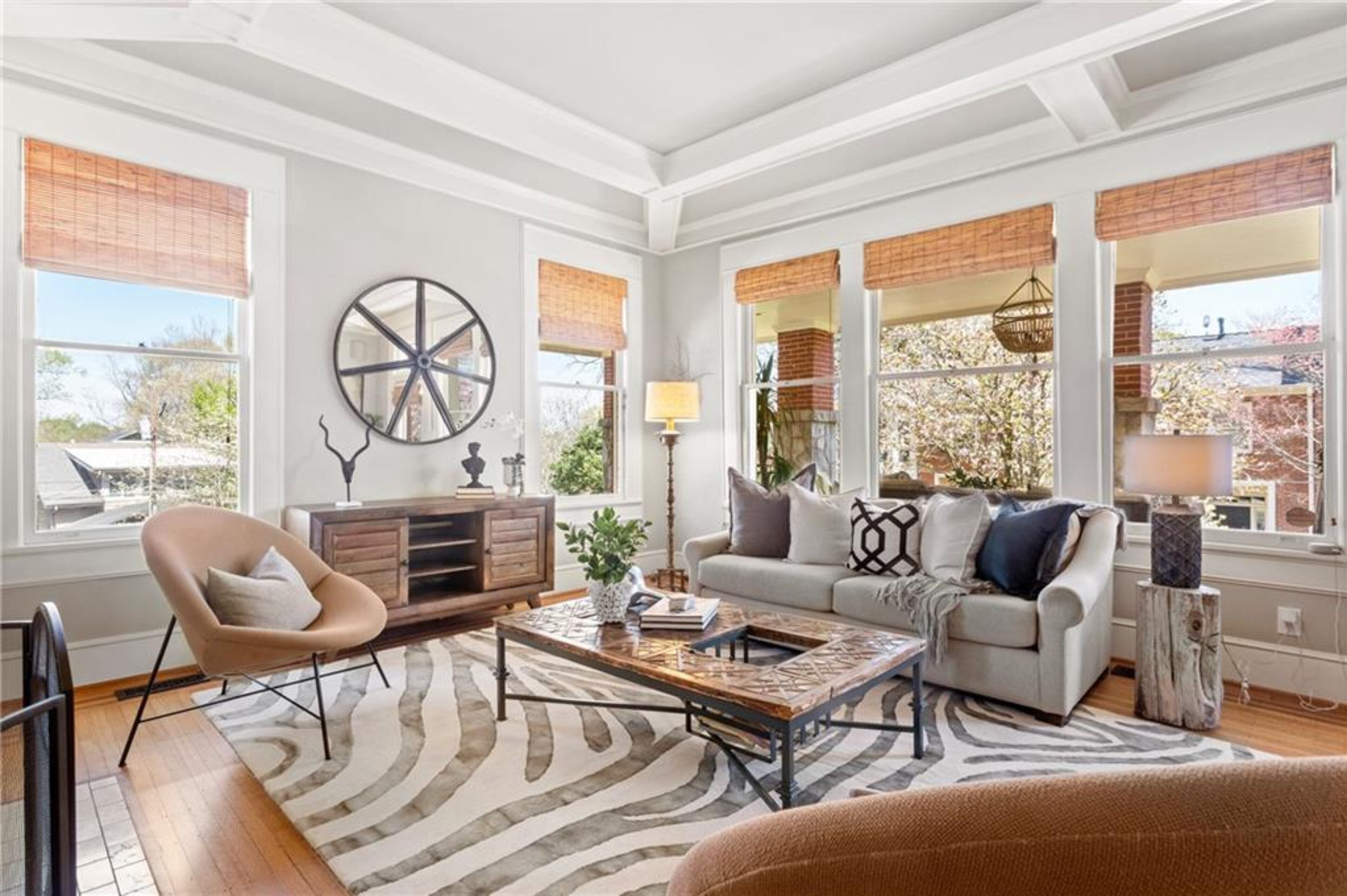 The living area features original 1910 hardwoods and coffered ceilings.