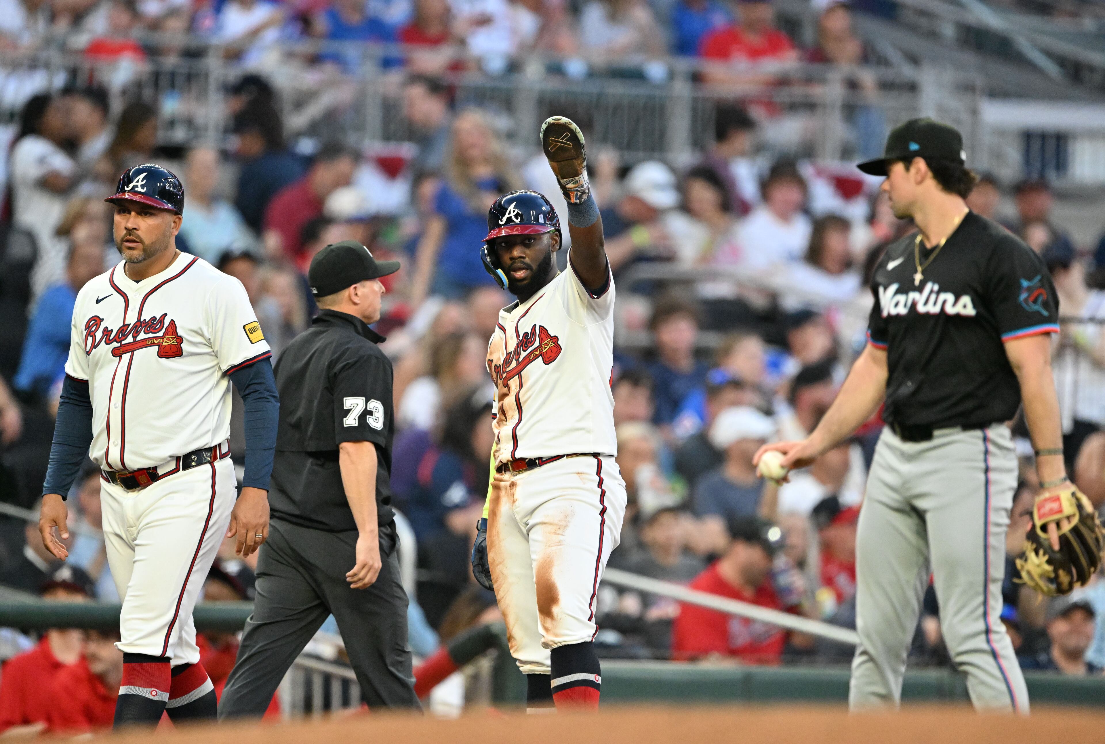 Atlanta Braves outfielder Michael Harris II (23) reacts at third base after Atlanta Braves second base Ozzie Albies (1) hitting a single during the third inning of home opener baseball game at Truist Park, Friday, April 4, 2025, in Atlanta. (Hyosub Shin / AJC)