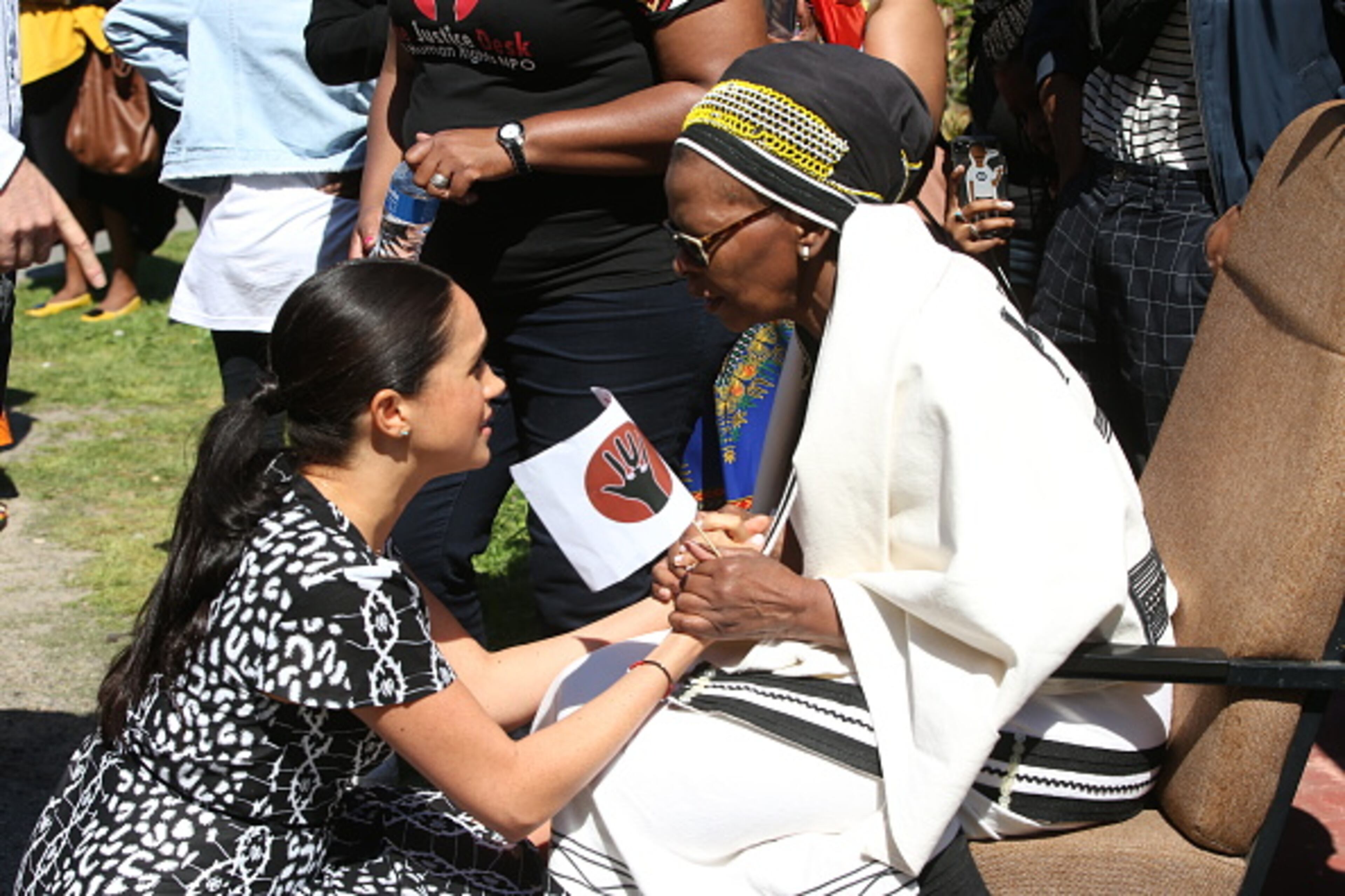 CAPE TOWN, SOUTH AFRICA - SEPTEMBER 23: Meghan, Duchess of Sussex greets a wellwisher during a visit to The Justice Desk on September 30, 2019 in Cape Town, South Africa. The Justice Desk initiative teaches children about their rights and provides self-defence classes and female empowerment training to young girls in the community. (Photo by Ian Vogler - Pool/Getty Images)
