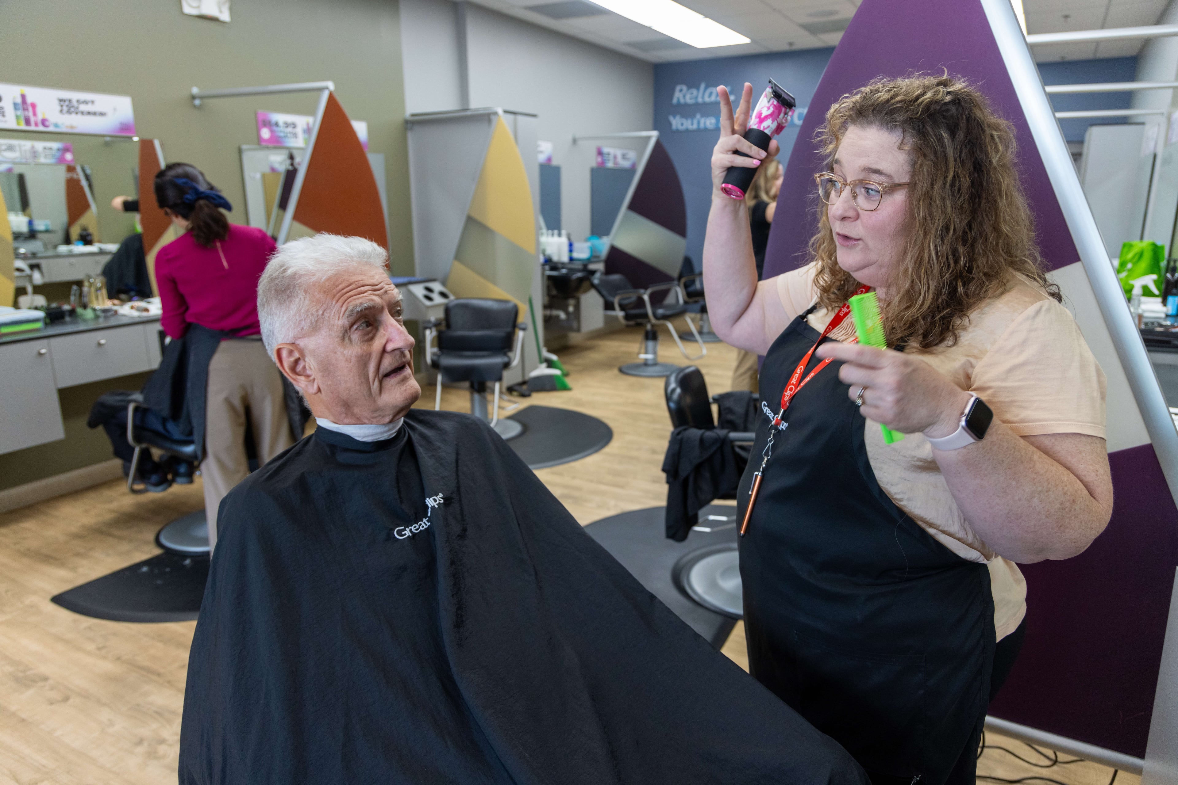 Salon Manager Susan Perdue (right) communicates with her clients by reading their lips in the mirror. PHIL SKINNER FOR THE ATLANTA JOURNAL-CONSTITUTION