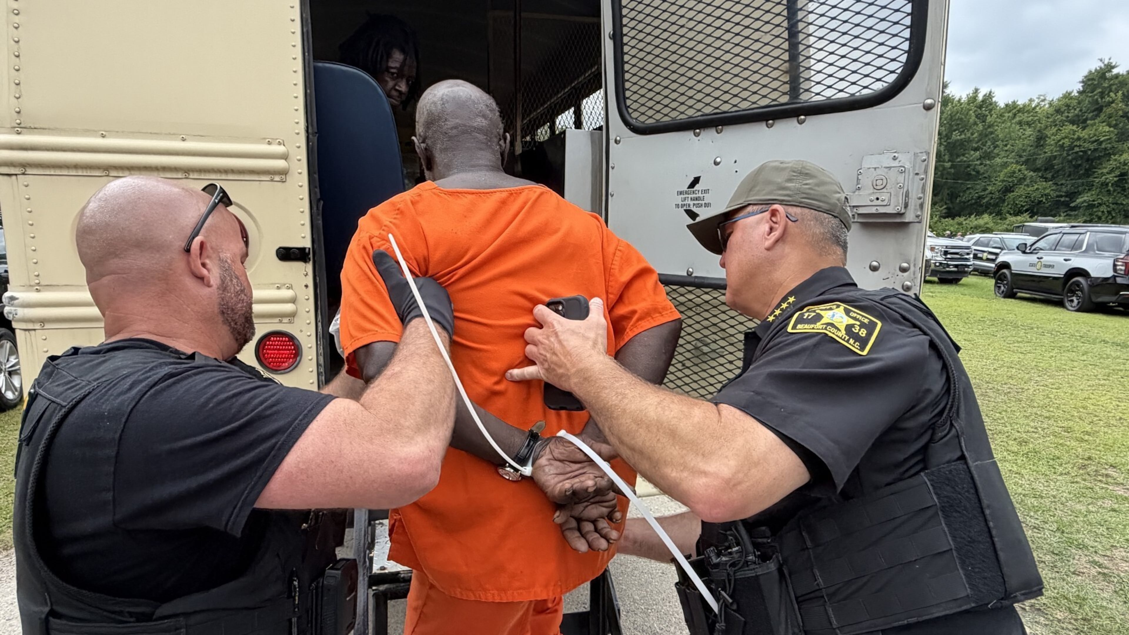 In this photo provided by the North Carolina State Bureau of Investigation, law enforcement officers load an inmate for transport Monday, June 29, 2026, at the Bertie-Martin Regional Detention Center Windsor, Bertie County, N.C. (North Carolina Bureau State Bureau of Investigation via AP)
